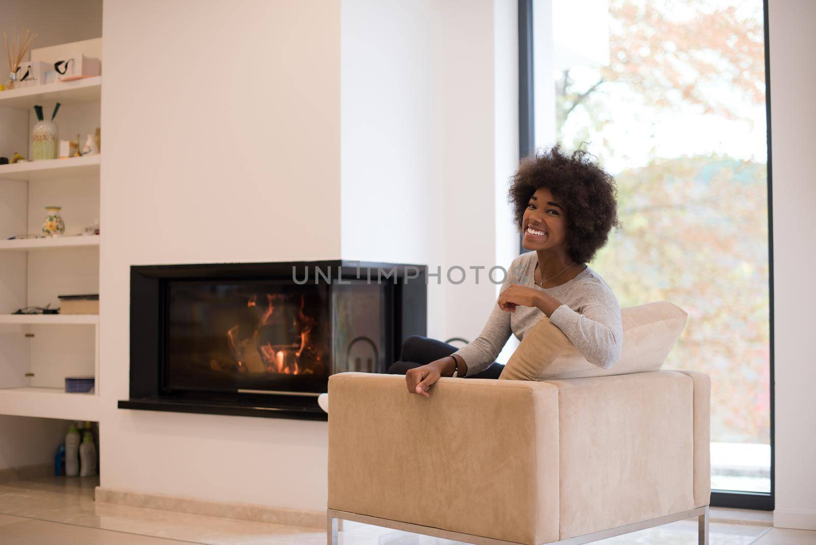 black woman in front of fireplace by dotshock
