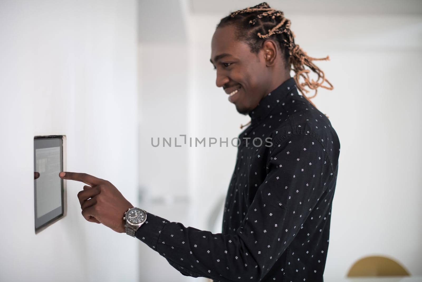 African man using smart home screen control system