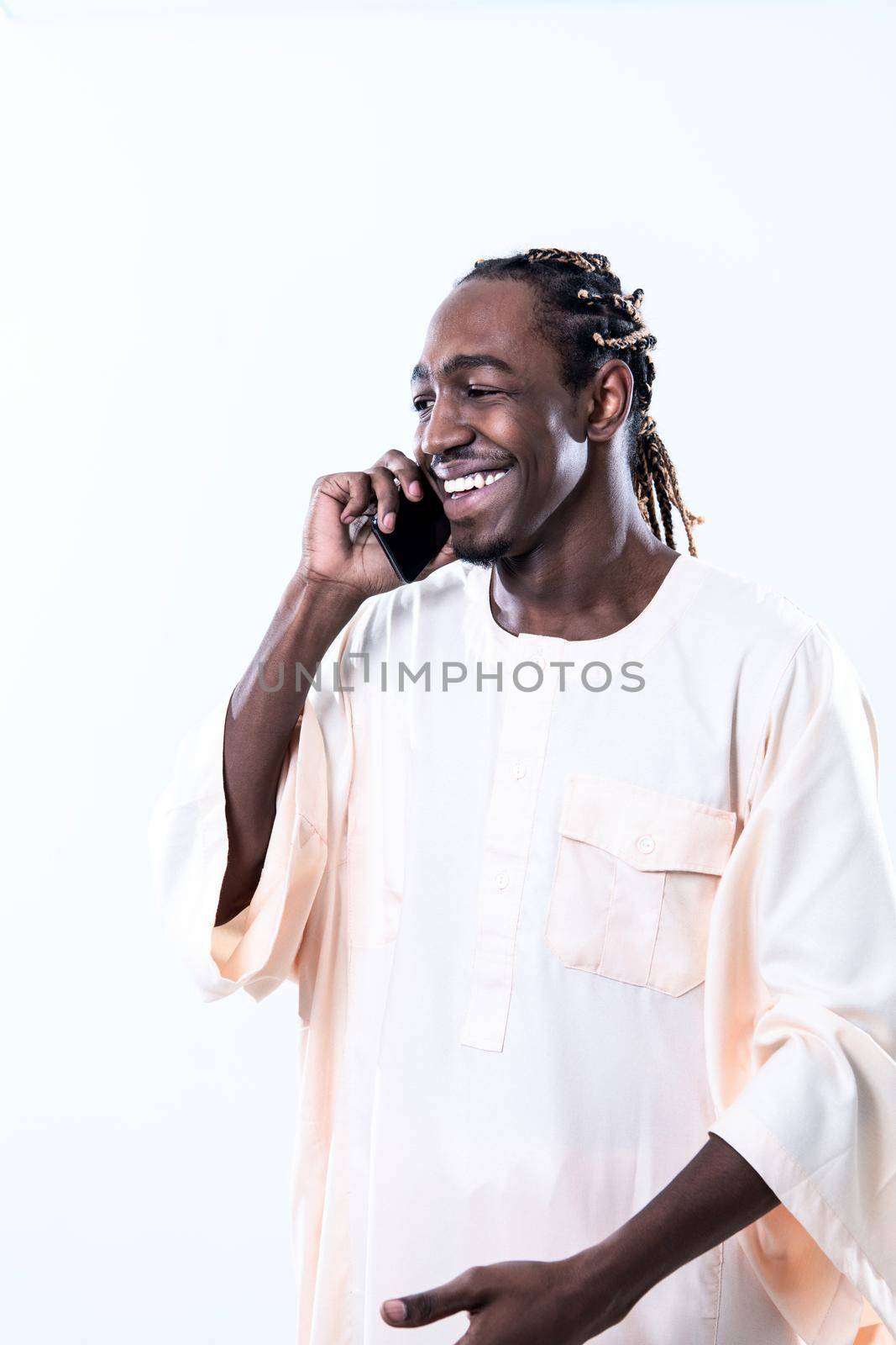 african man using smartphone by dotshock
