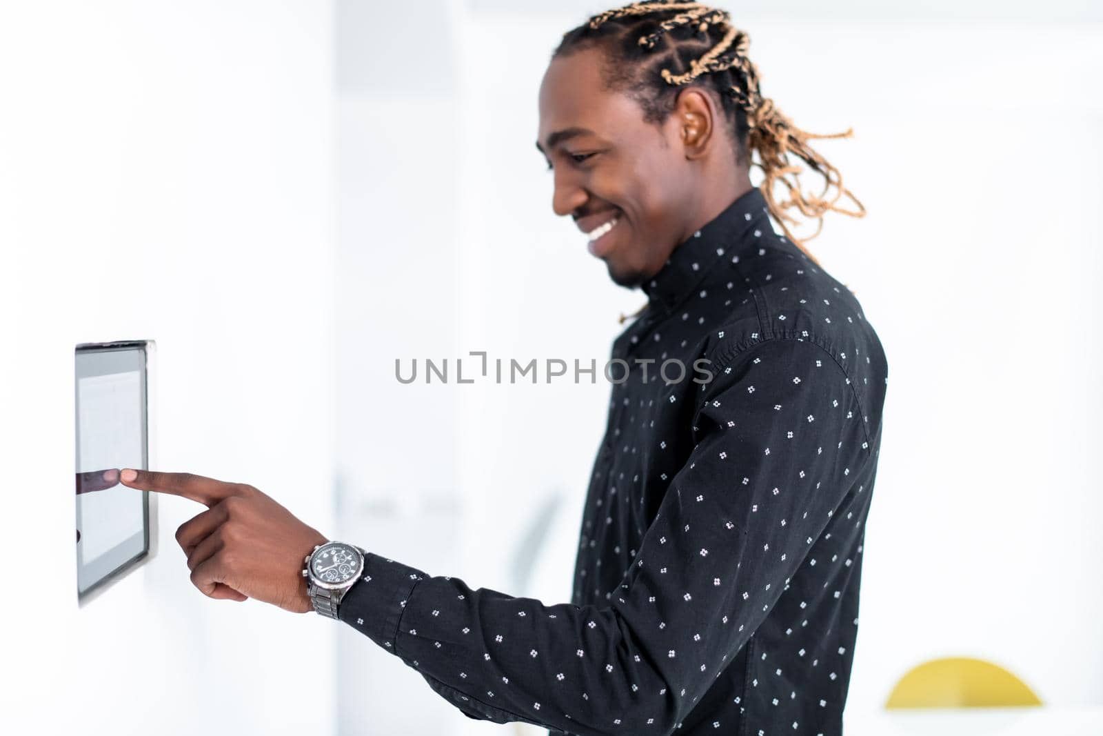 African man using smart home screen control system