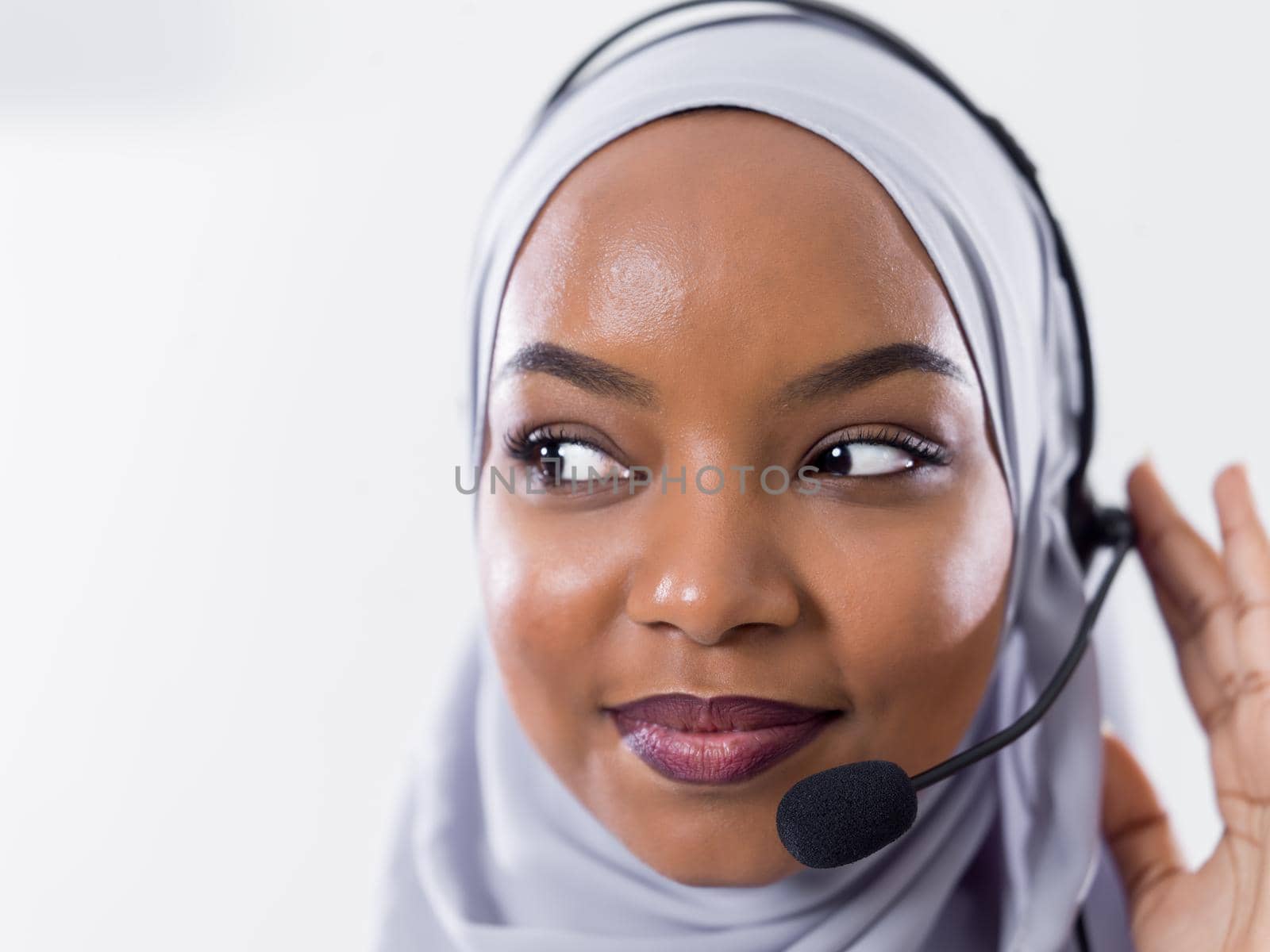 African muslim female with hijab scarf customer representative business woman with phone headset helping and supporting online with customer in modern bright call centre isolated on white background