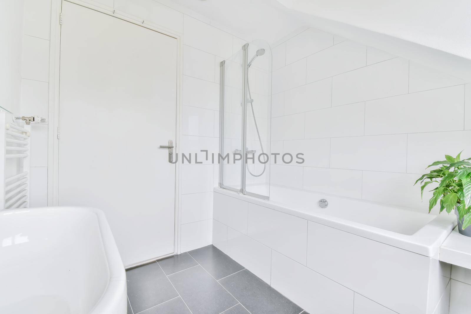 Luxurious bathroom with a huge bathtub in elegant apartment