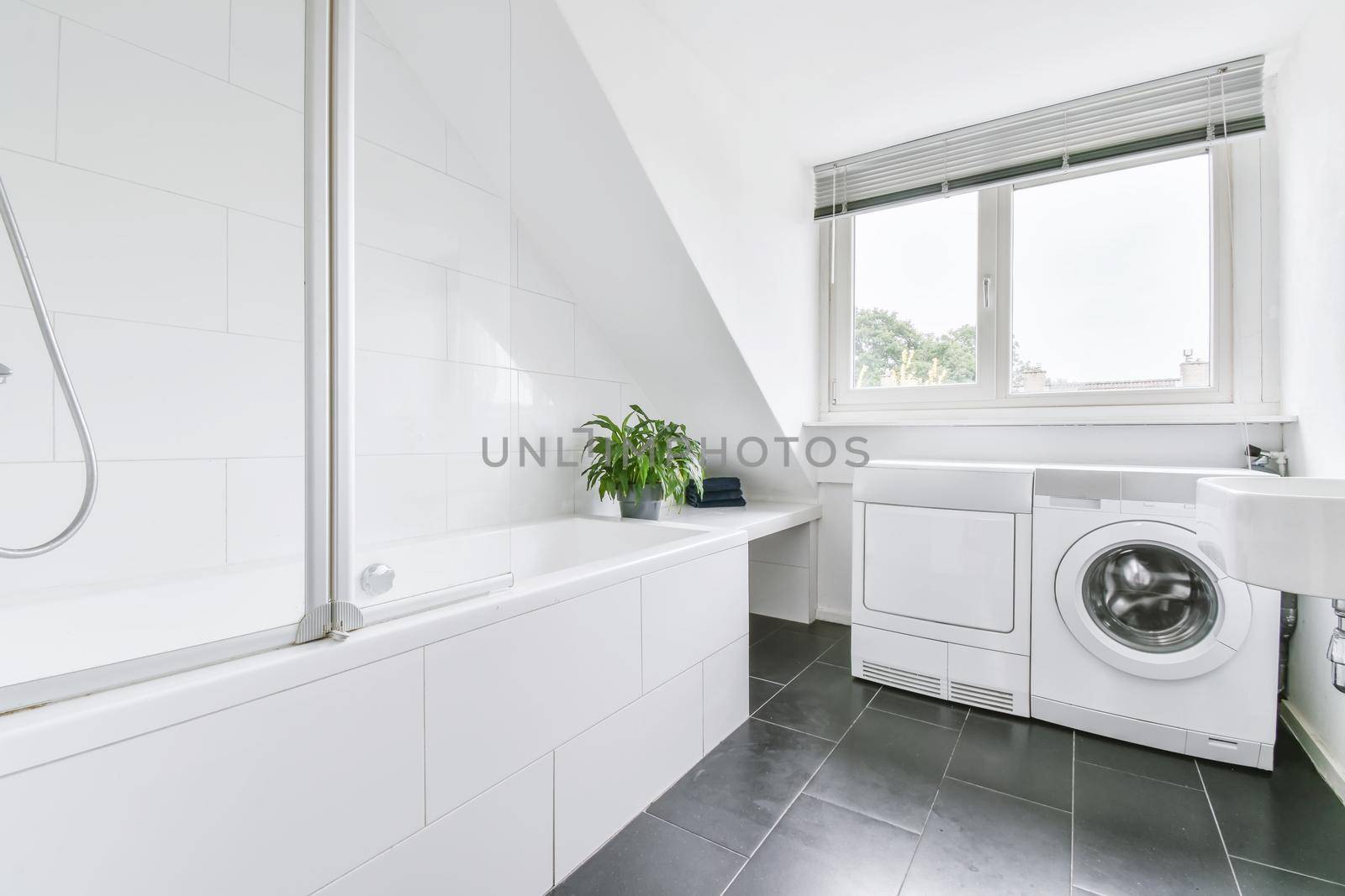 Luxurious bathroom with a huge bathtub in elegant apartment