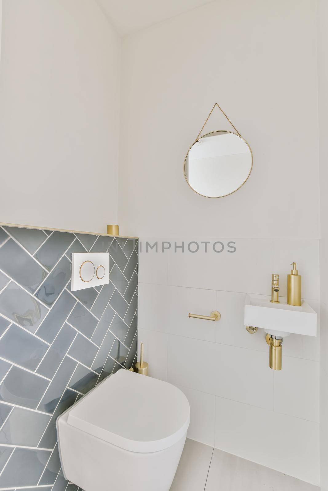 Stunning washroom with blue tiles and small round mirror