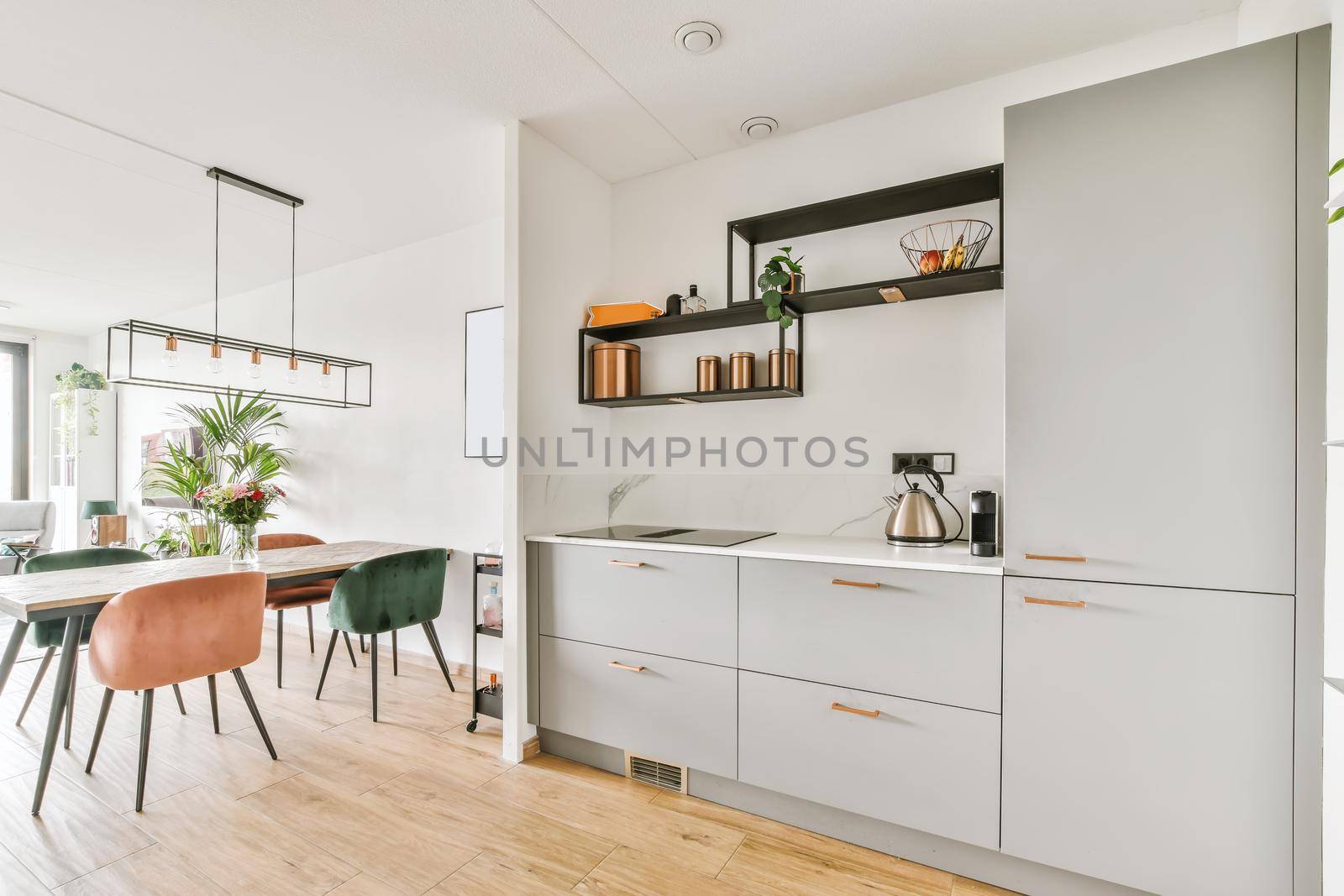 Stunning kitchen with gray kitchen unit and wall shelves