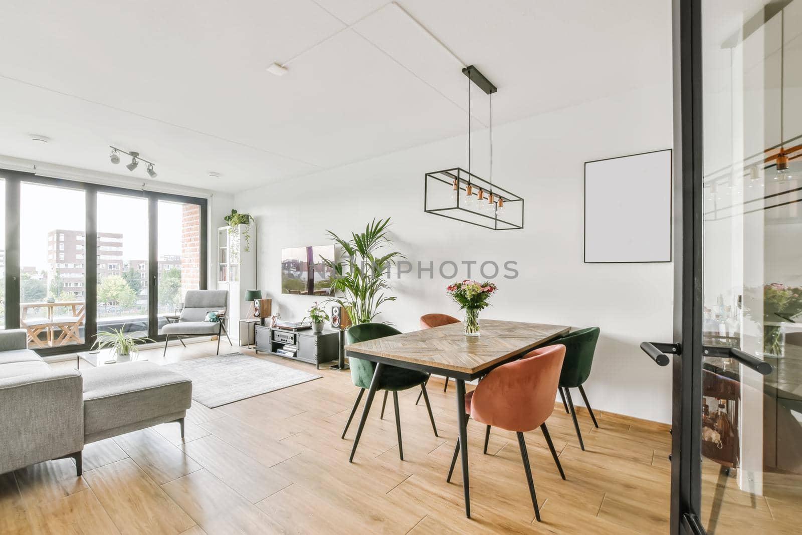 Stunning dining area for four with pink green velvet chairs