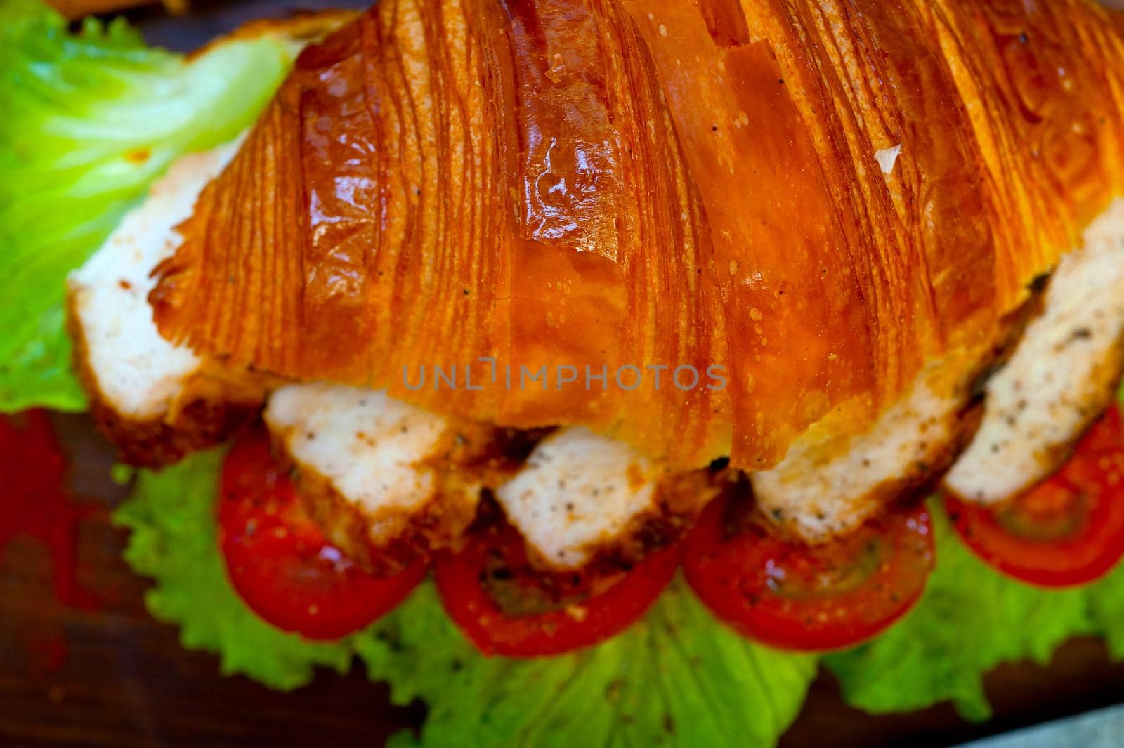 savory croissant brioche bread with chicken breast and vegetable rustic style 