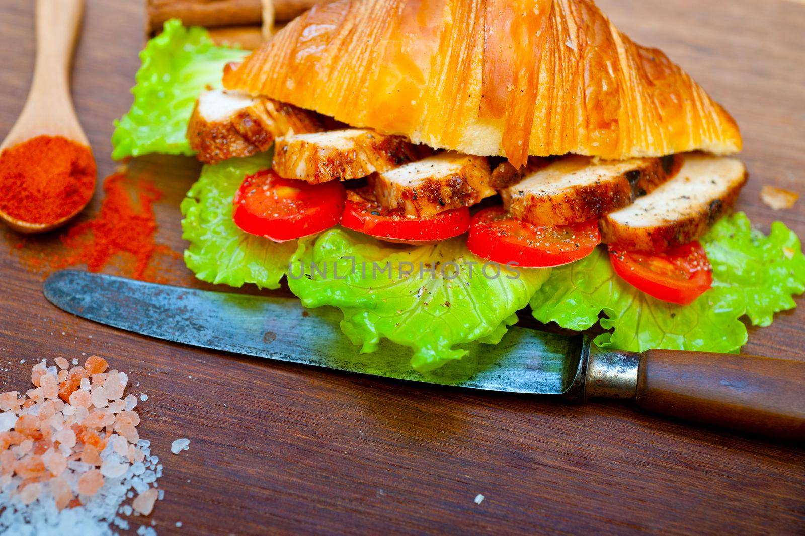 savory croissant brioche bread with chicken breast and vegetable rustic style 