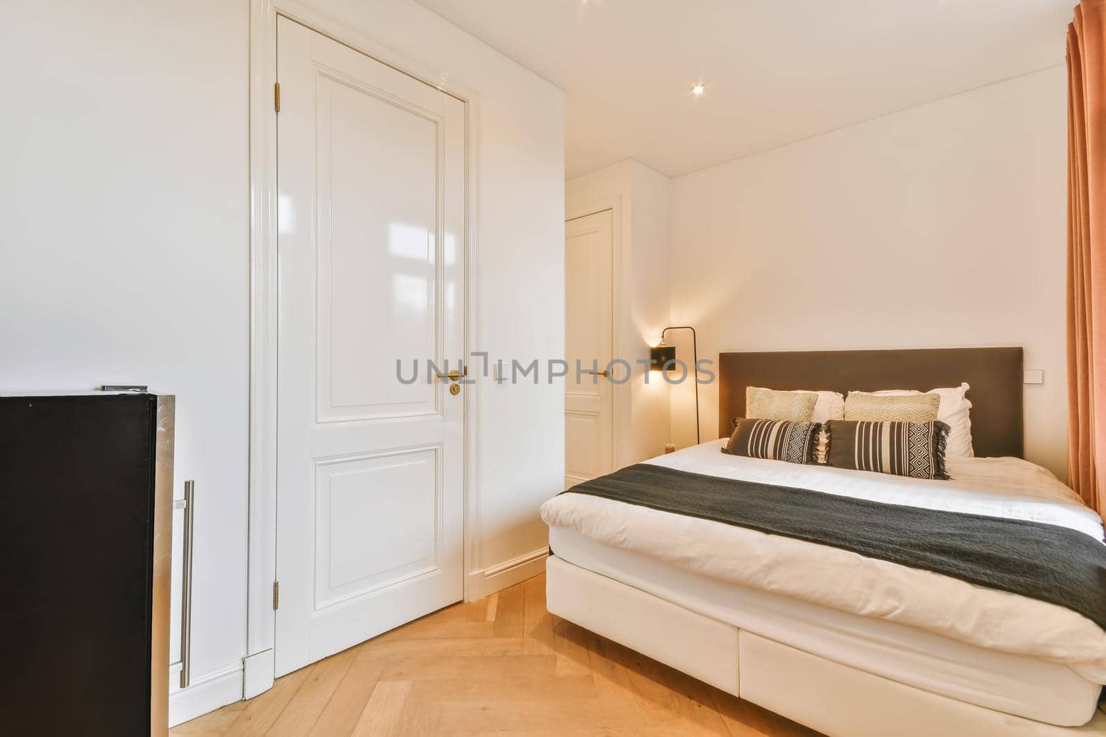 Elegant and cozy bedroom with a double soft bed