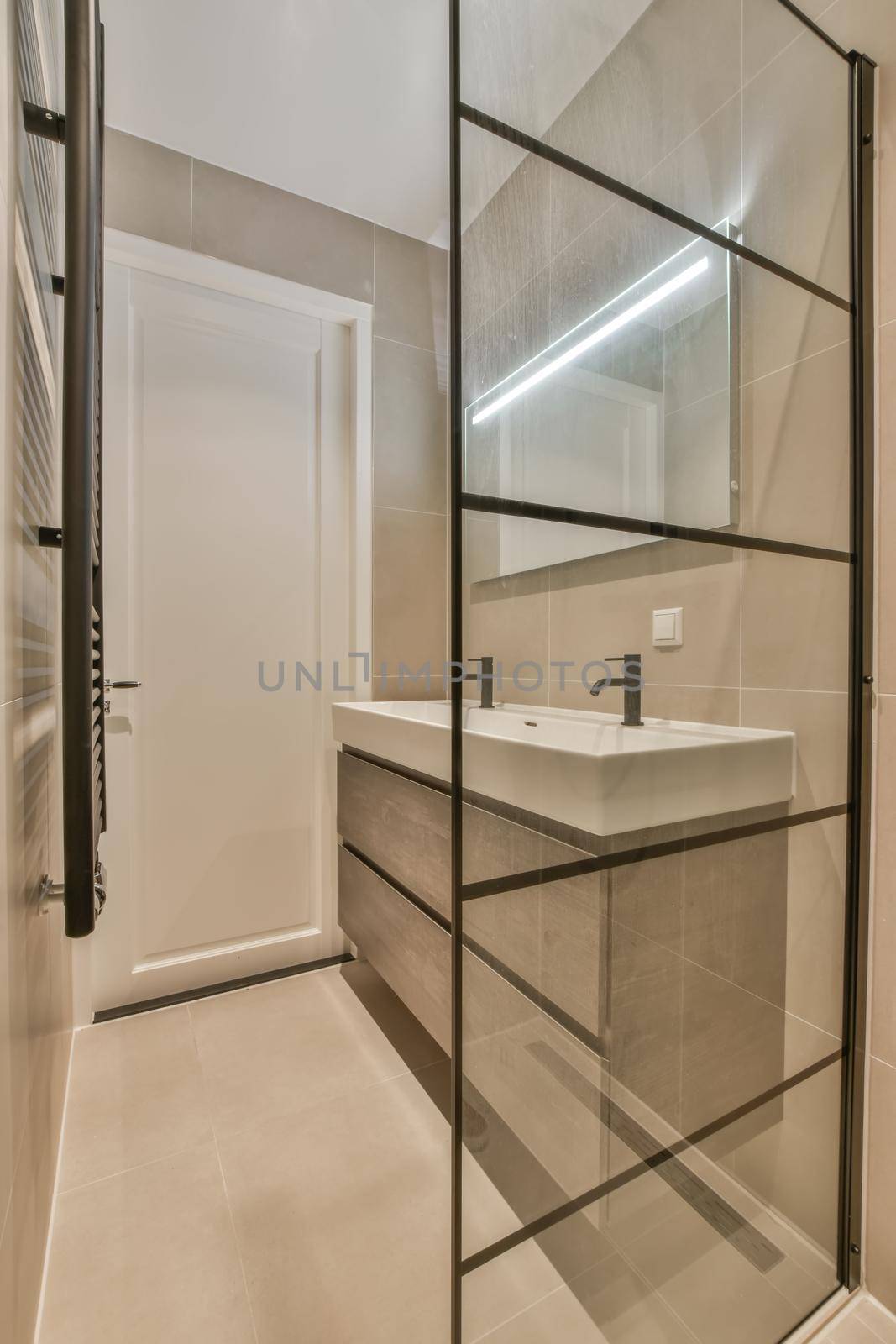 Stylish bathroom in a minimalist style in beige and black tones