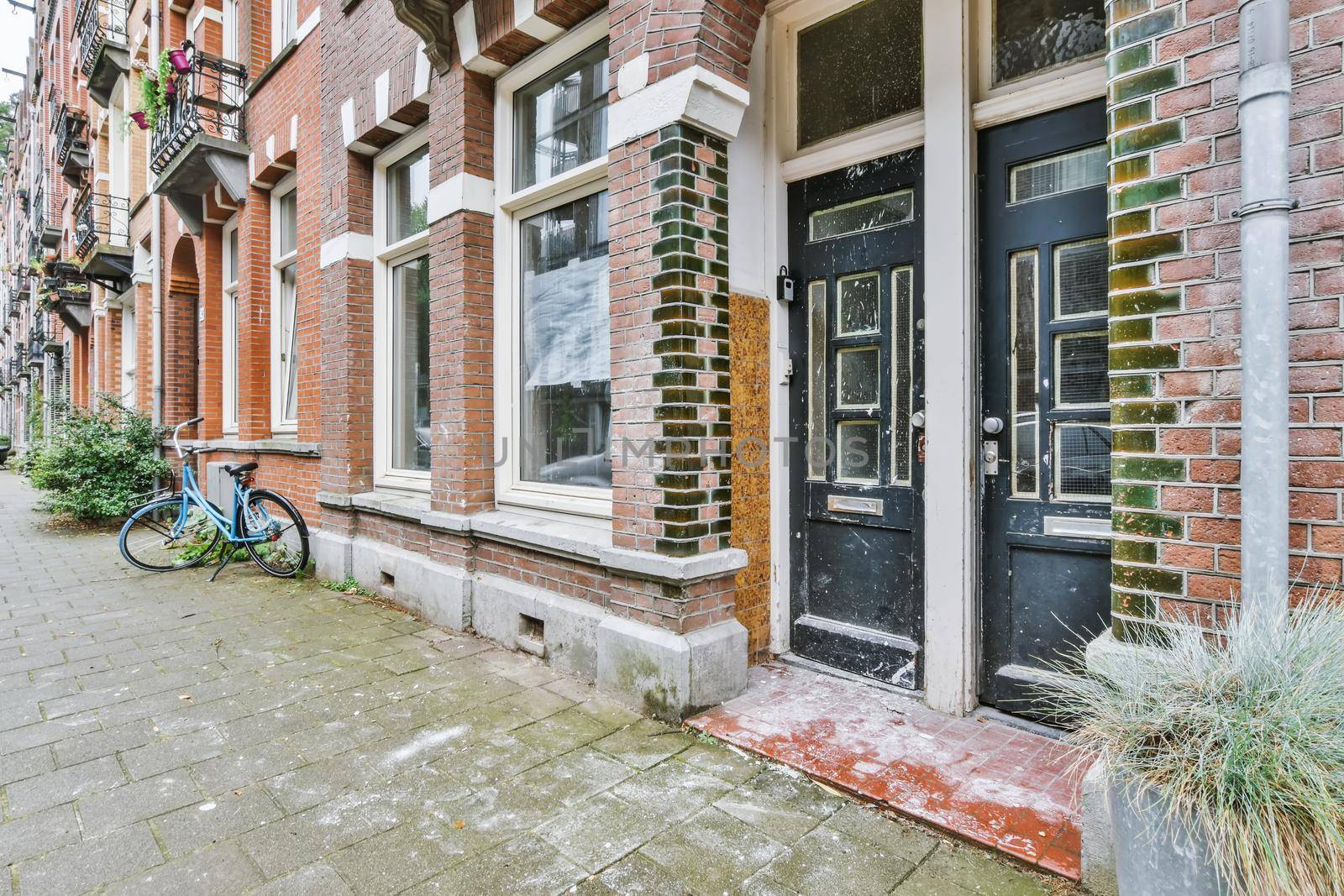 Residential building front door with black doors