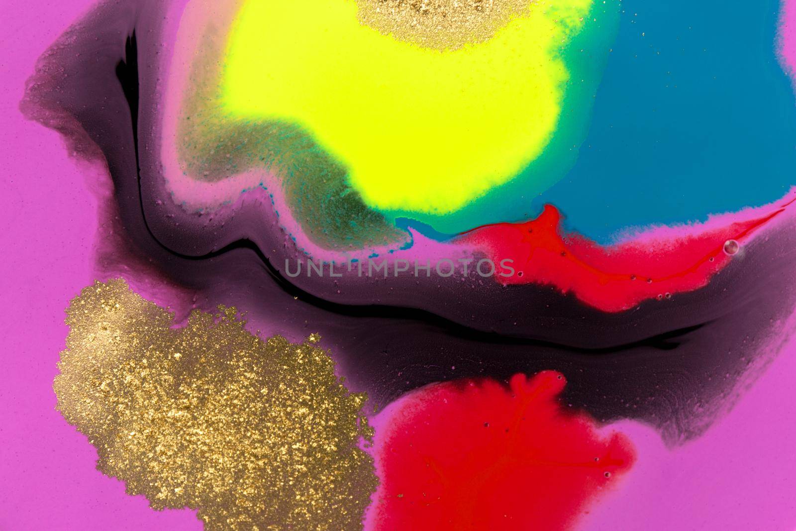 Abstract fluorescent ink liquid mix with gold dust