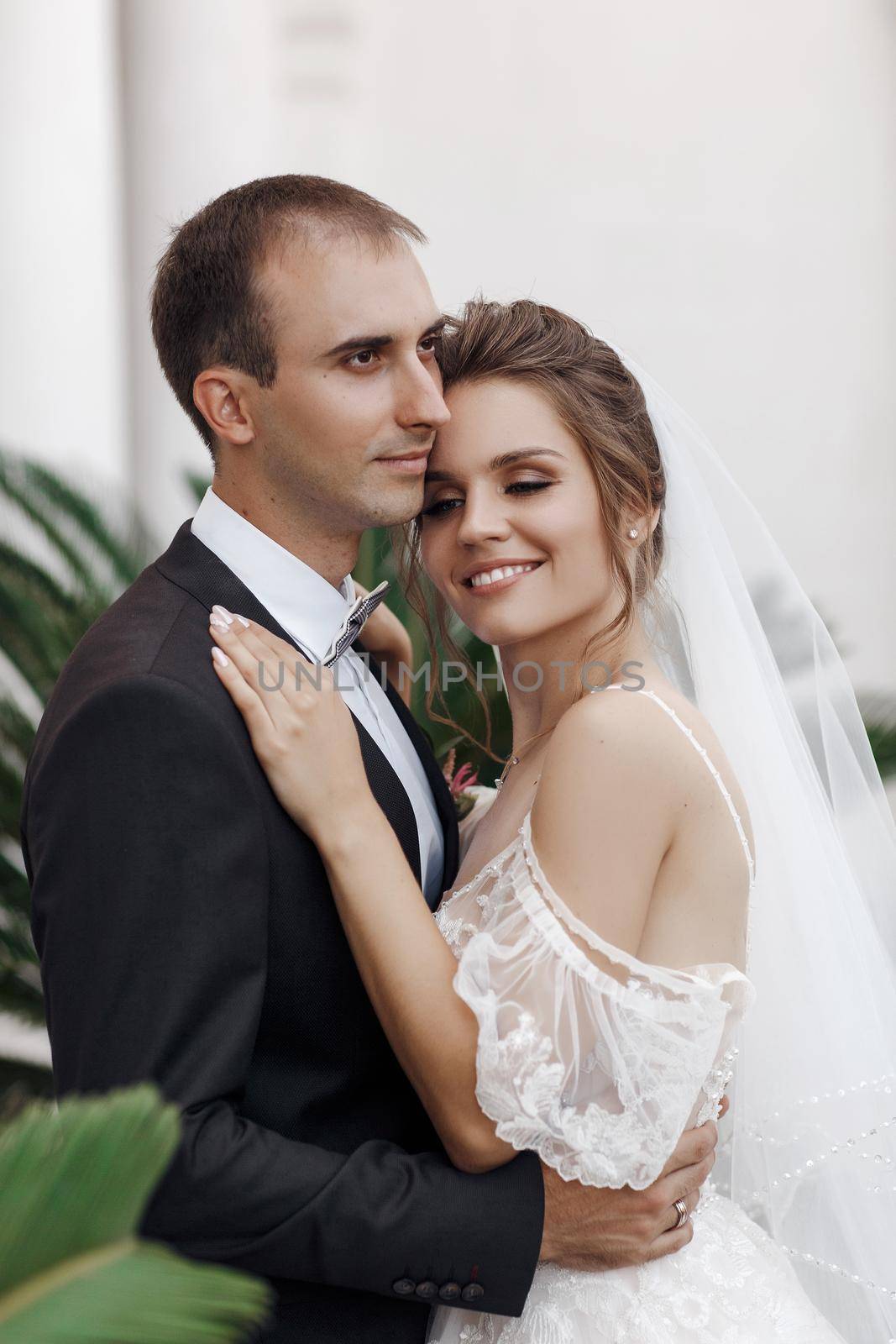 Wedding portrait of a smiling bride and groom. High quality photo