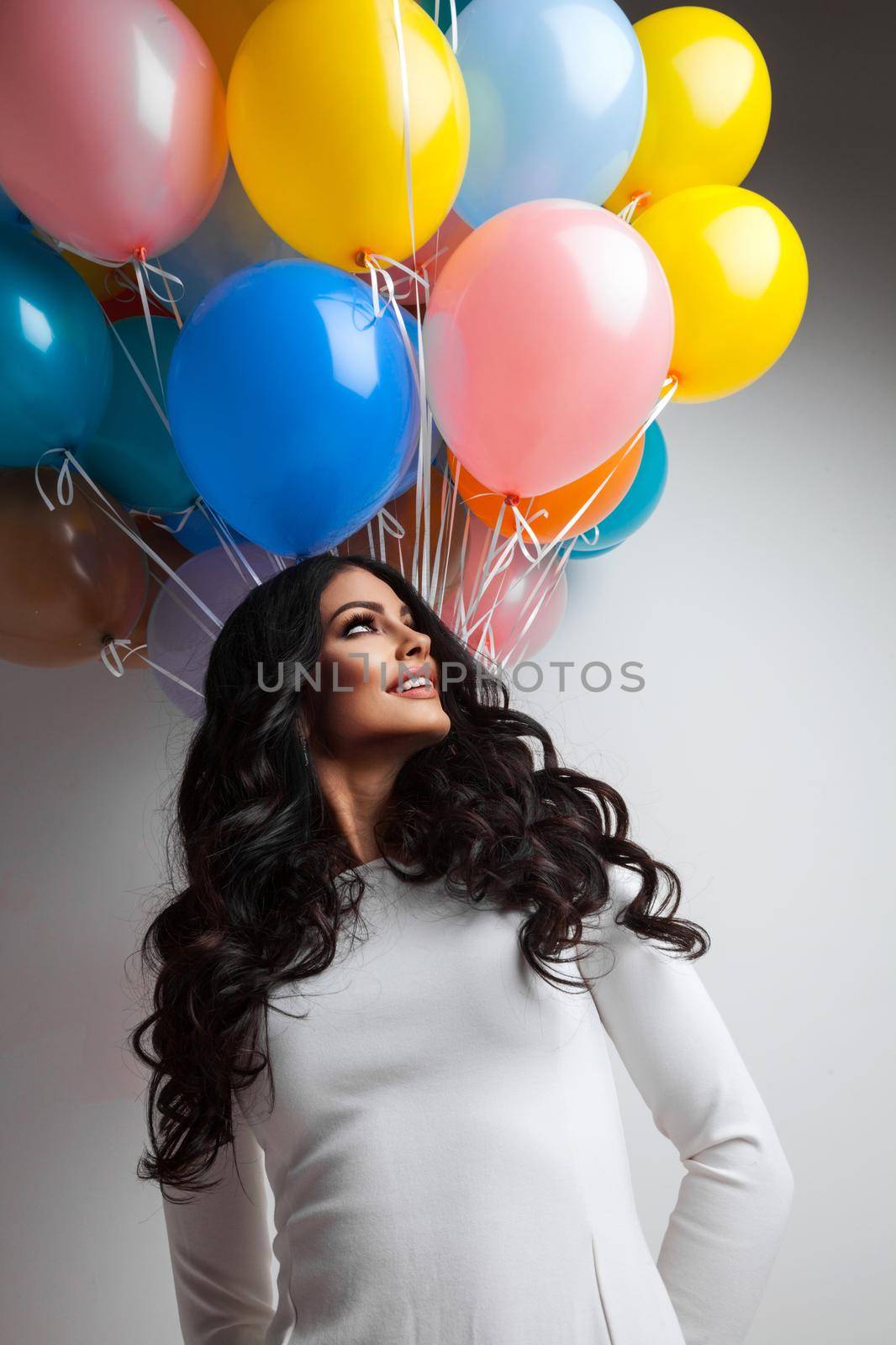 Happy girl with many colorful balloons birthday Valentine day gift