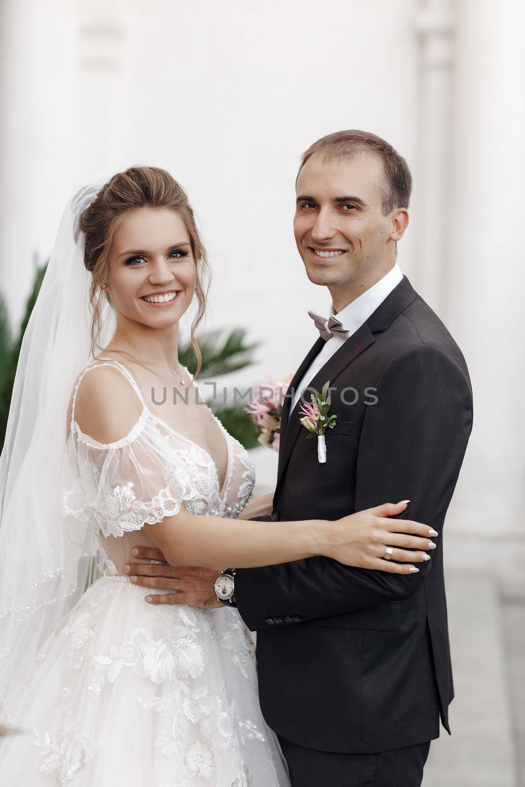 Wedding portrait of a smiling bride by splash