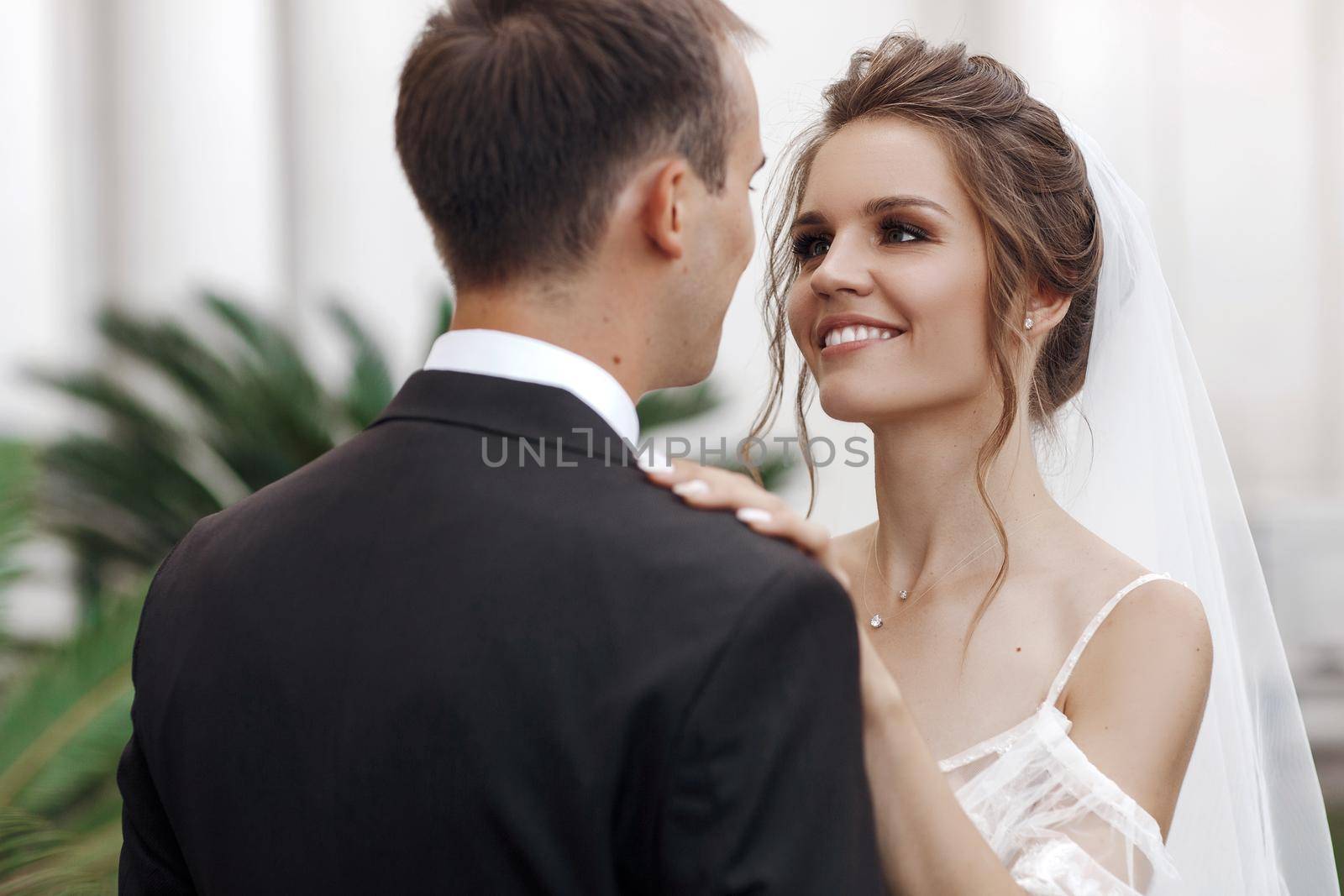 Wedding portrait of a smiling bride and groom. High quality photo