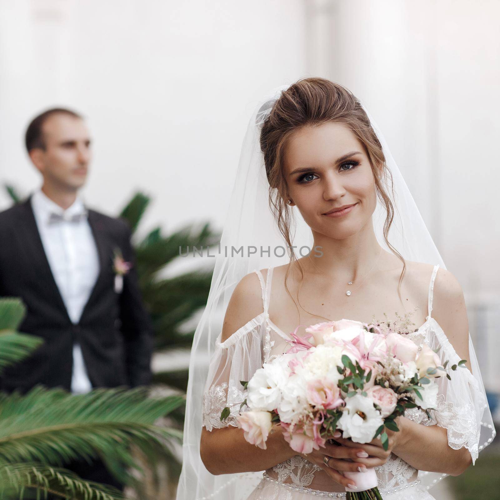 Wedding portrait of a smiling bride and groom. High quality photo