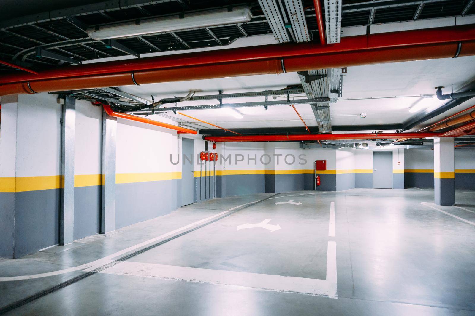 Corridor of a large heated underground car park. High quality photo