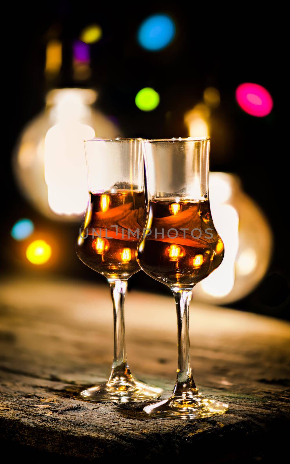 Brandy in a glass on a wooden table