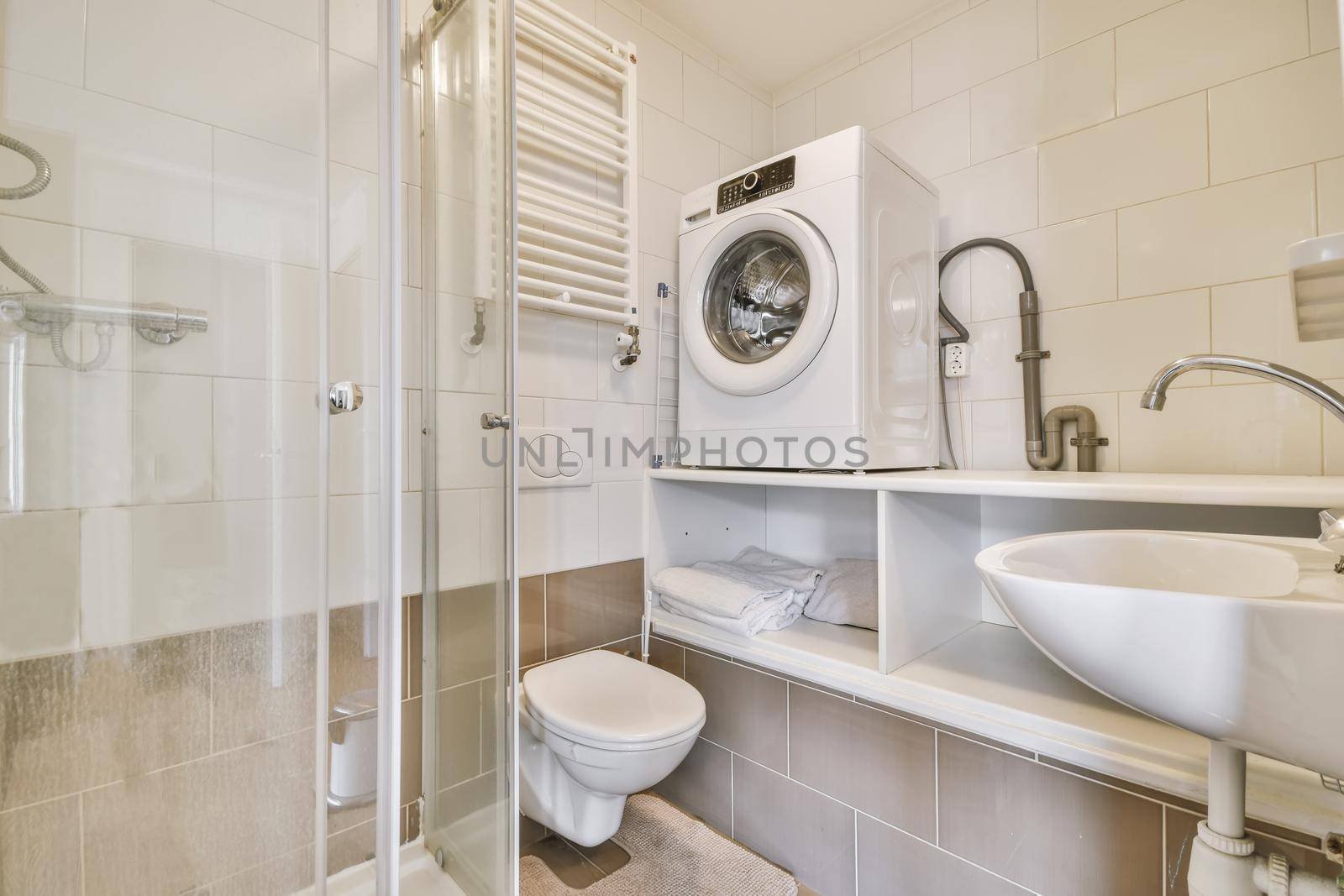 Delightful bathroom with radiator and washing machine