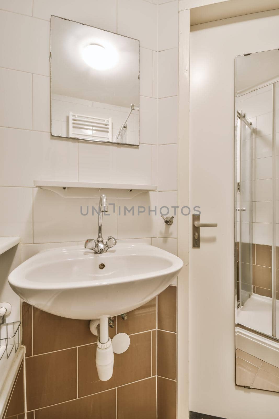 Delightful bathroom with sink and shelf under the mirror