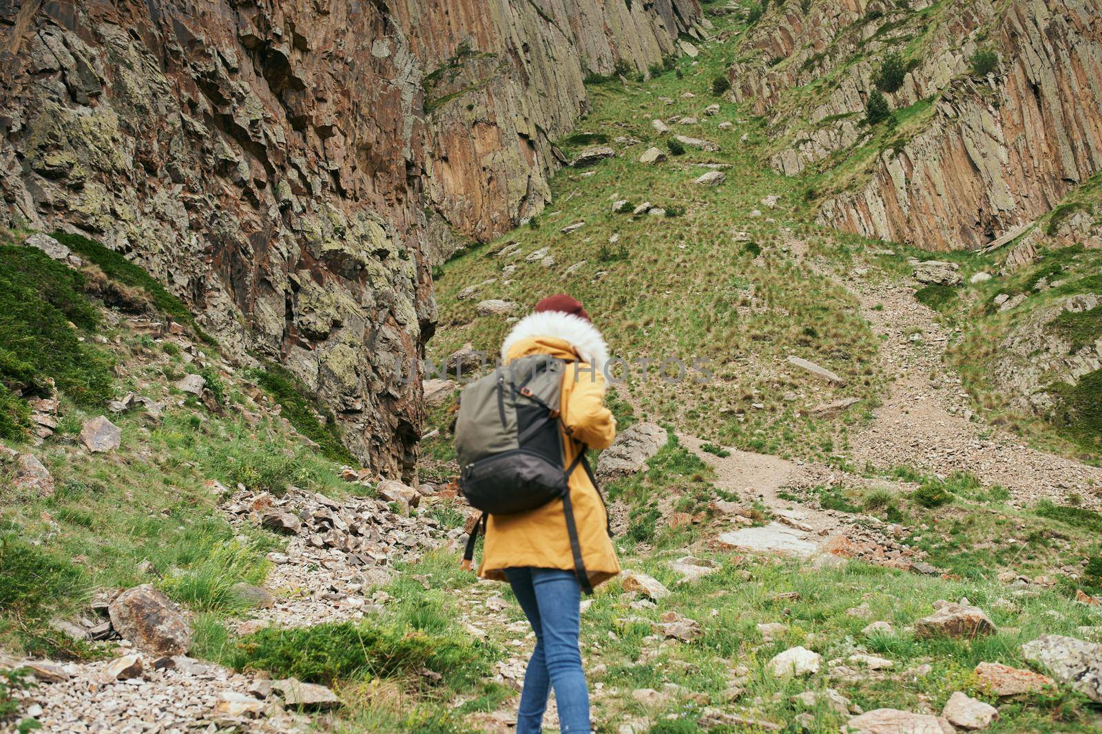 woman hiker with backpack mountains travel adventure freedom by Vichizh