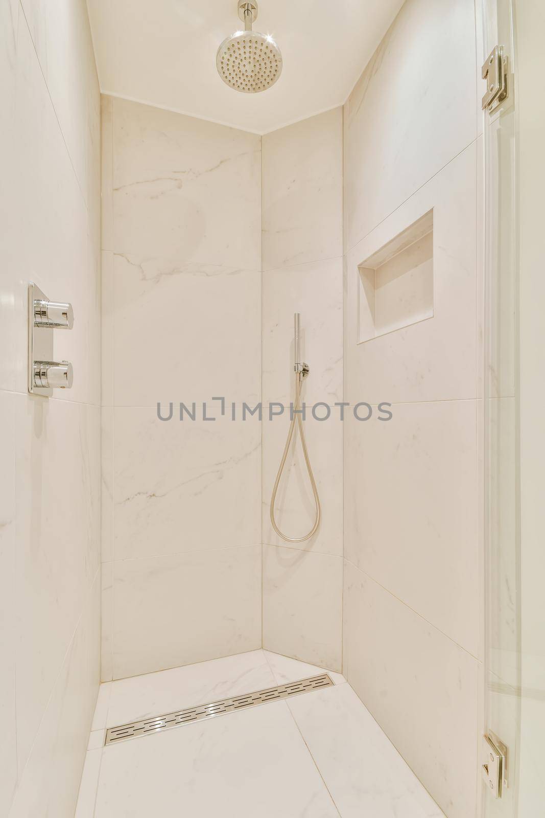Luxurious bathroom with built-in shower head in the shower