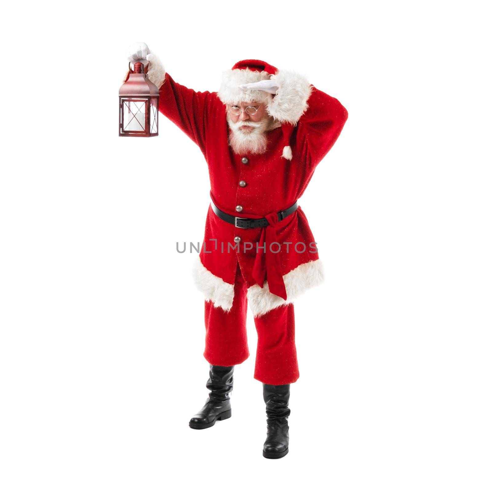 Santa Claus with lantern isolated over white background