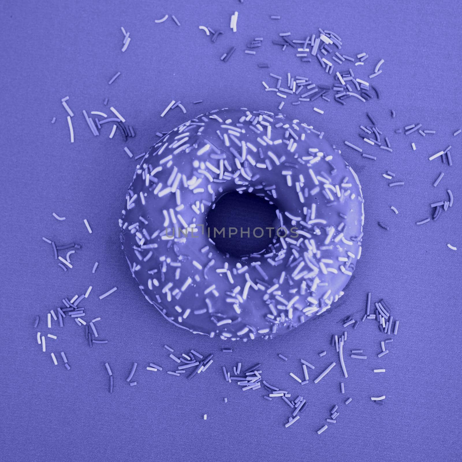 Violet doughnuts. National donut day. Minimalism. Demonstrating the colors of 2022 - Very Peri