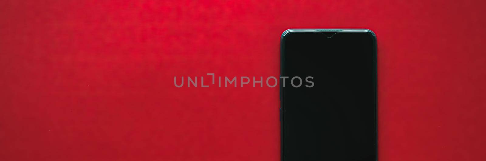 Mobile app design or smartphone screen flatlay concept. Mobile phone as new model presentation mockup or application template, brand marketing design on red background as flat lay.