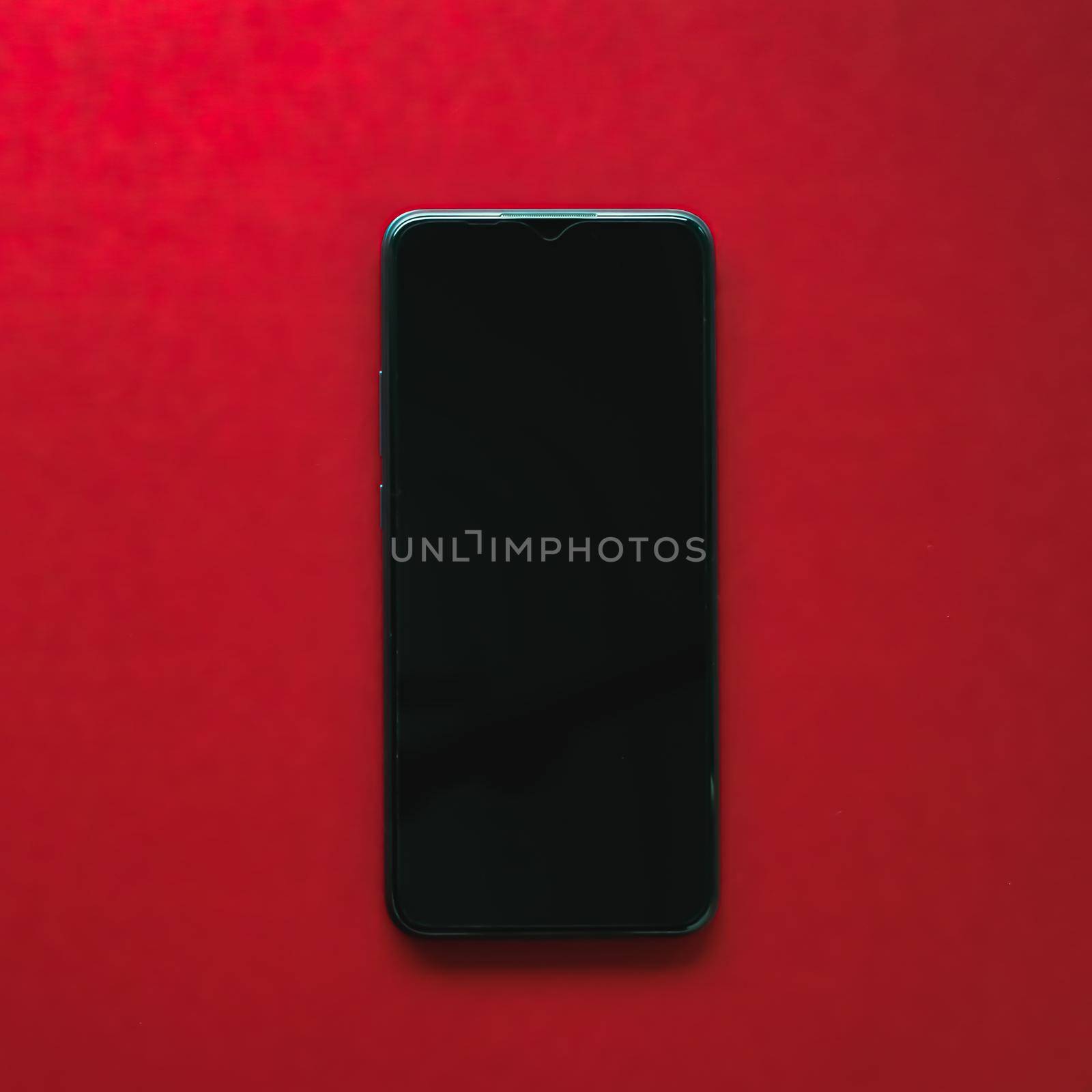 Mobile app design or smartphone screen flatlay concept. Mobile phone as new model presentation mockup or application template, brand marketing design on red background as flat lay by Anneleven
