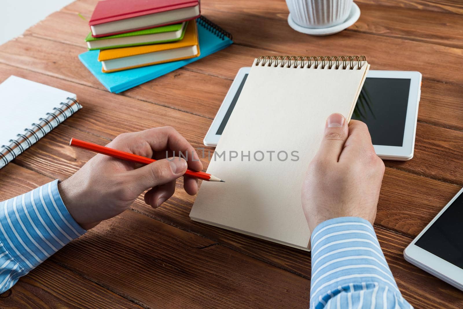 close-up of hands with notepad. office work