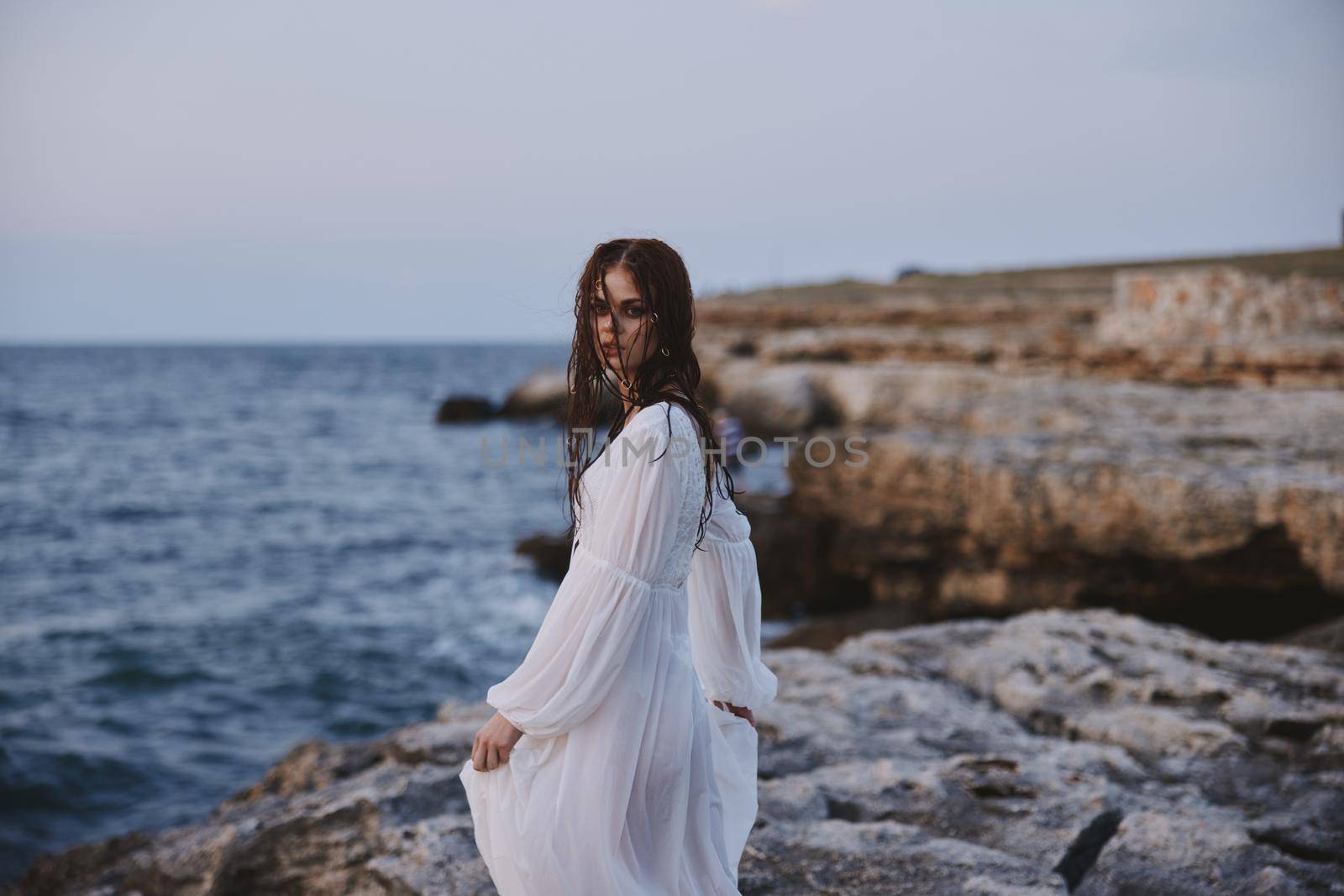 woman traveler enjoying for view of the beautiful sea on her holiday freedom. High quality photo