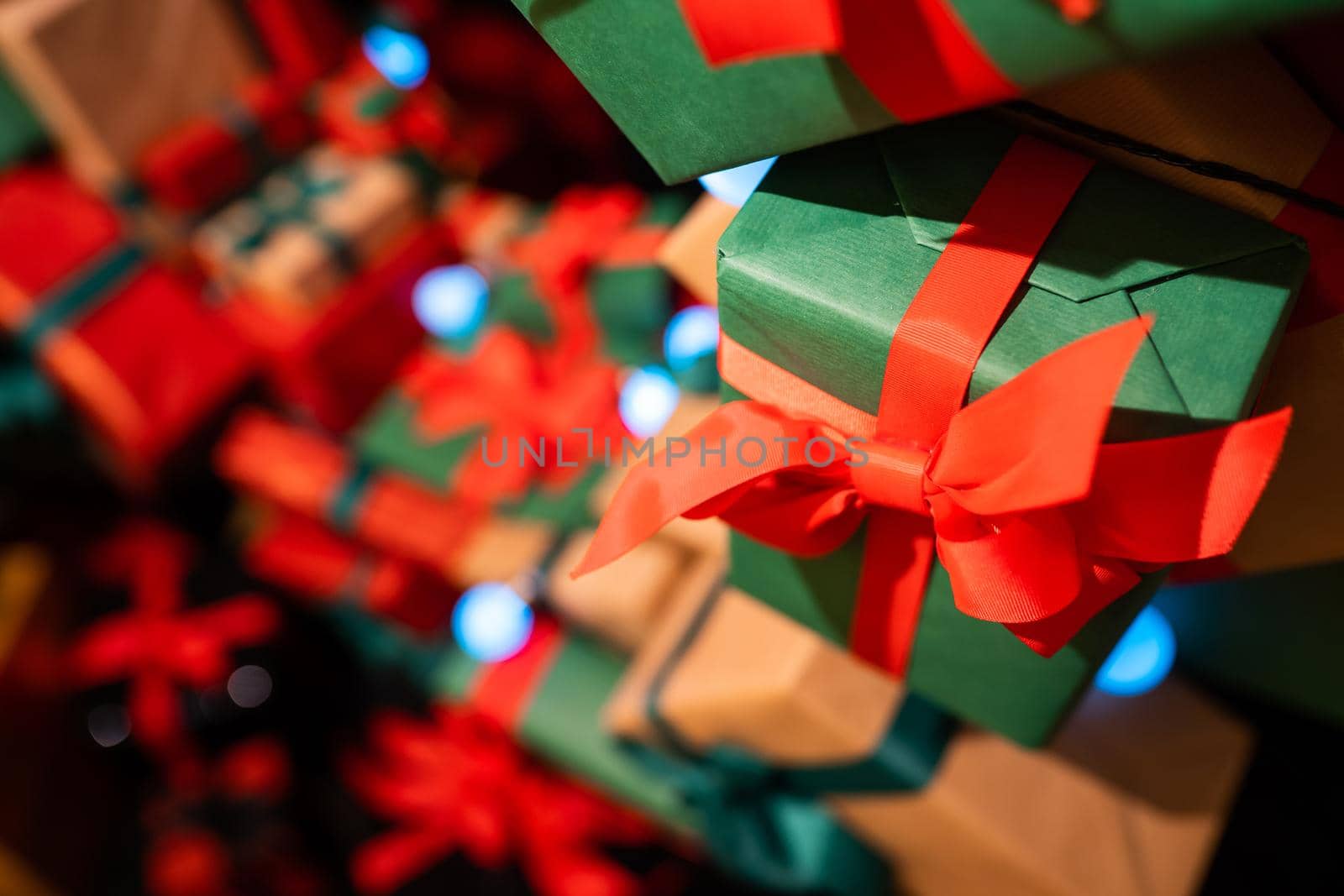 Gift boxes with ribbons of different colors, close angle