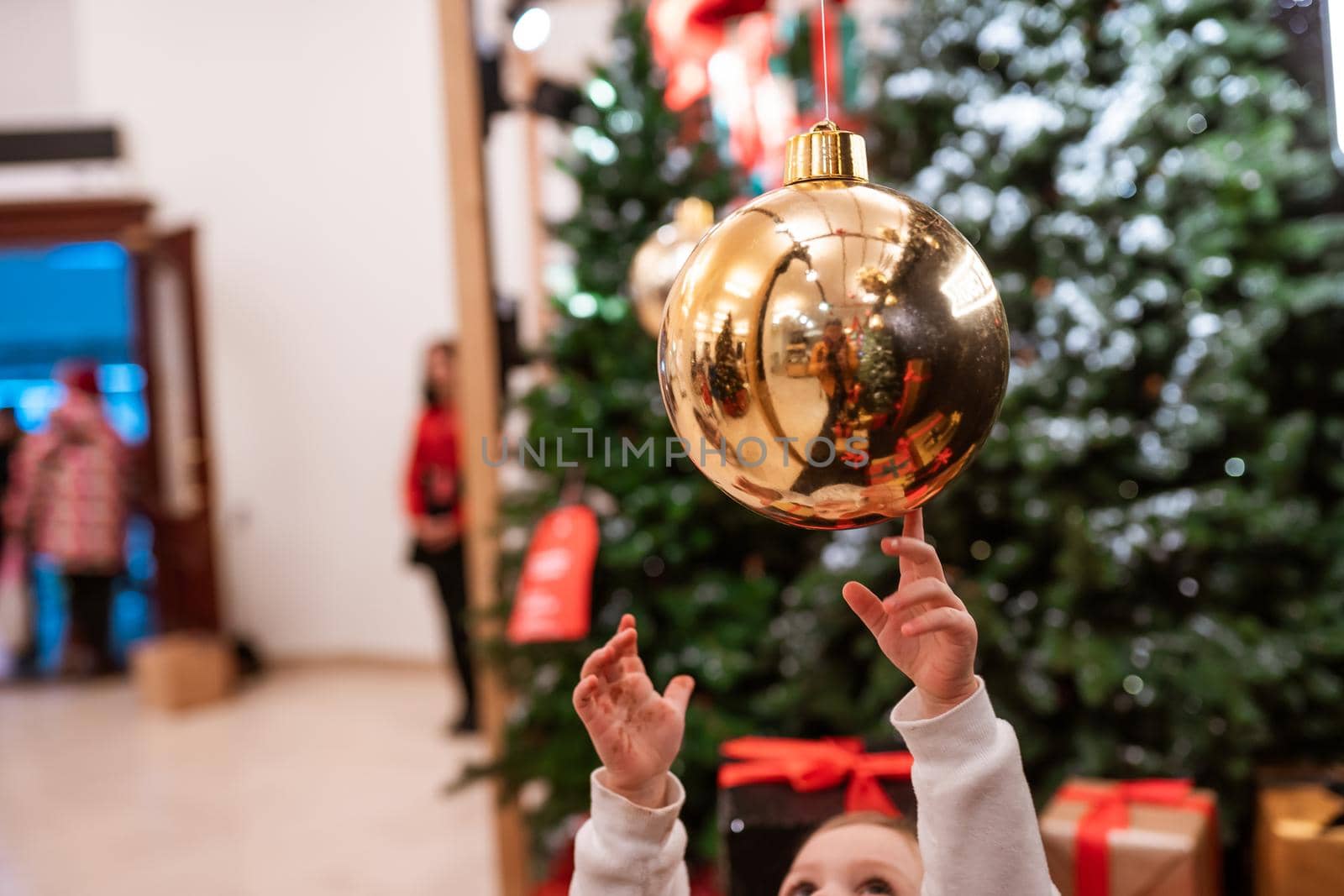 Different object toy gifts hanging on a decorated Christmas tree. by teksomolika