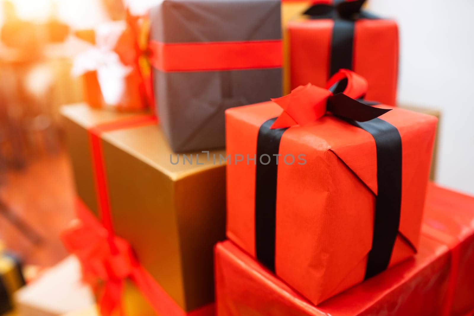 Gift boxes with ribbons of different colors, close angle