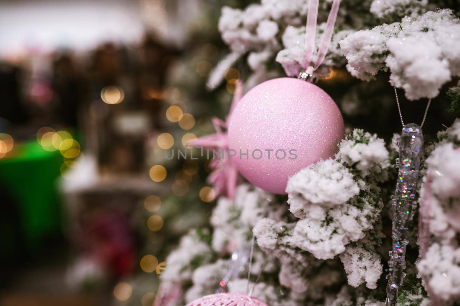 Different object toy gifts hanging on a decorated Christmas tree. by teksomolika