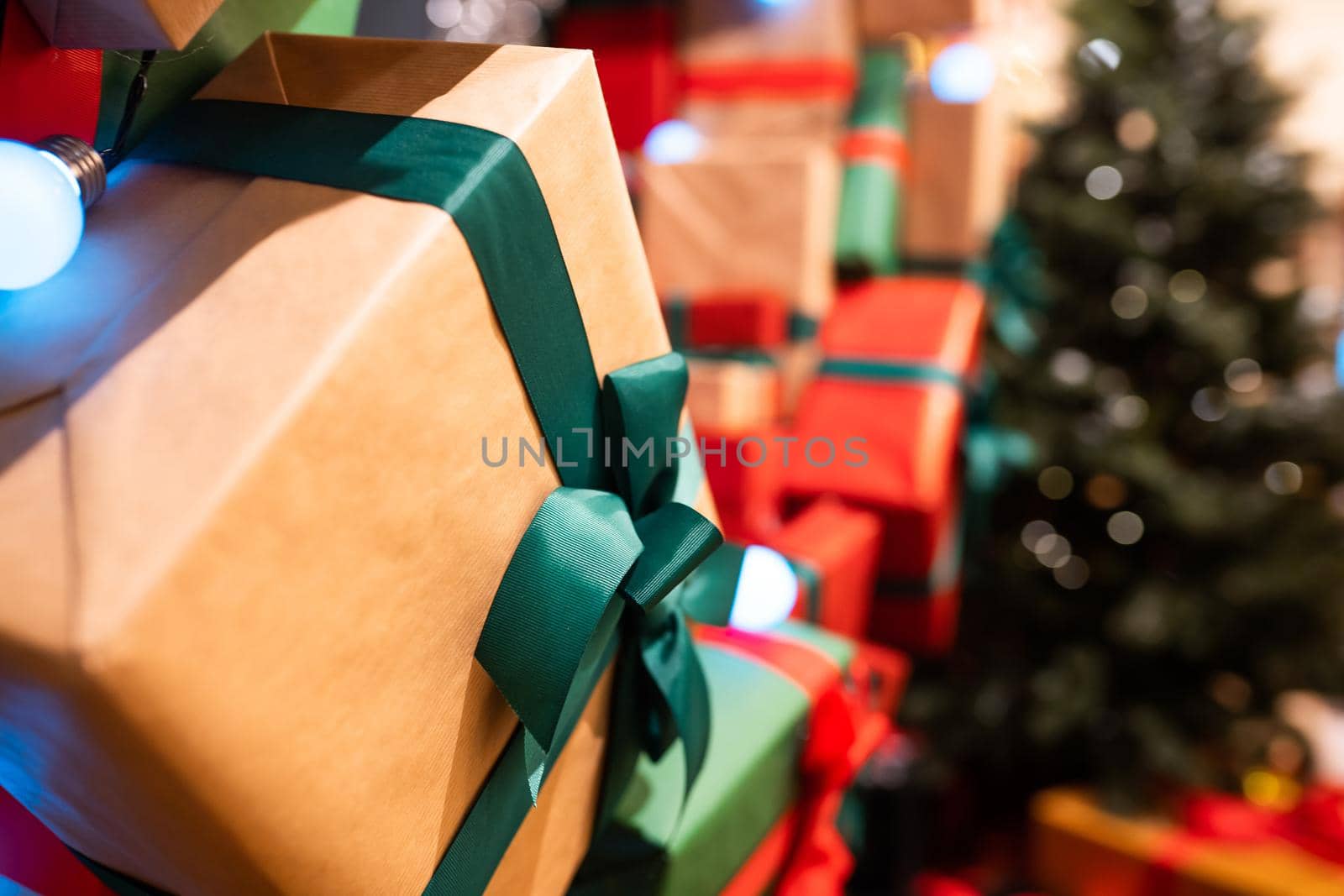 Gift boxes with ribbons of different colors, close angle