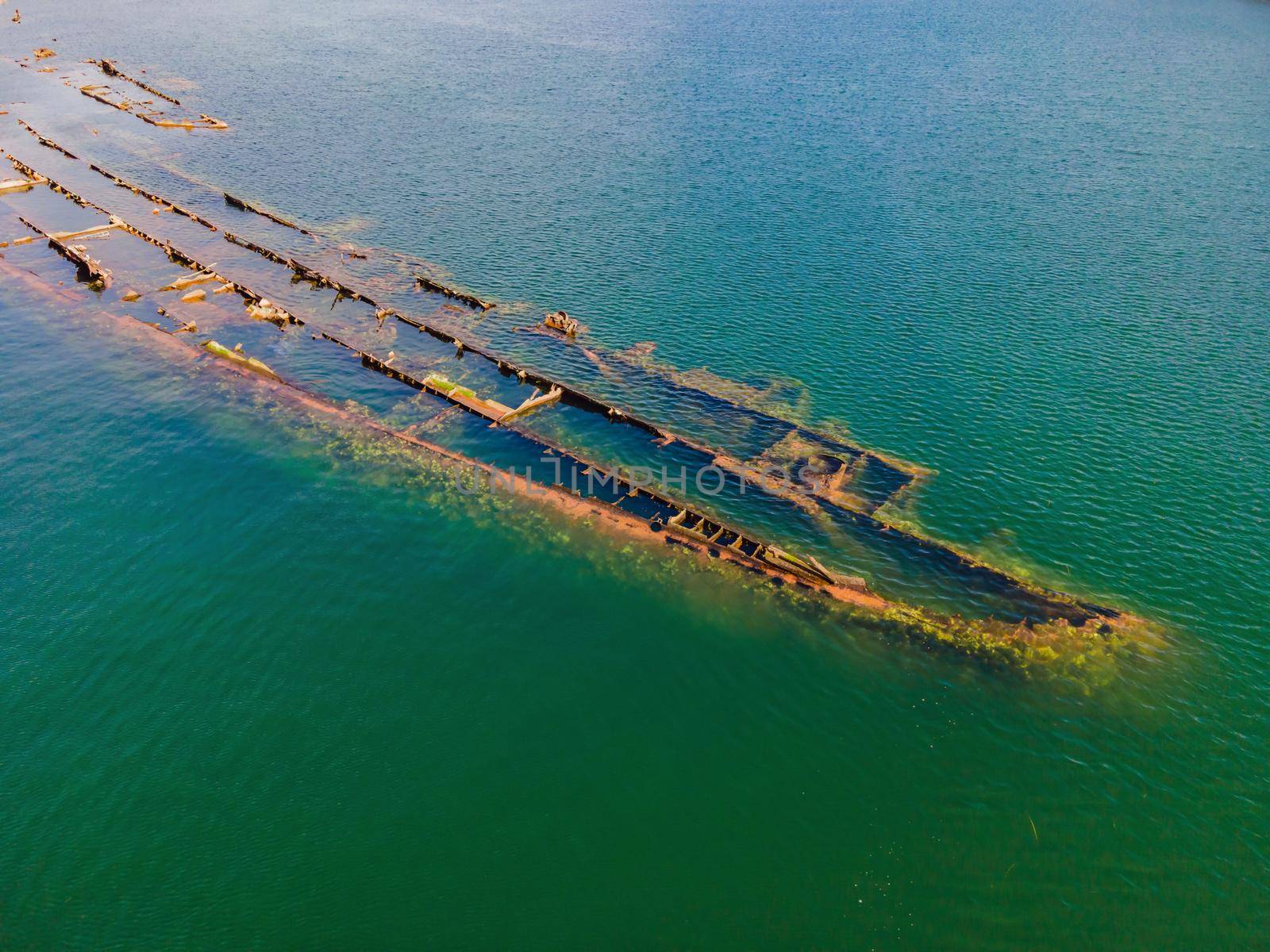 Abandoned broken shipwreck sticking out of the sea by galitskaya