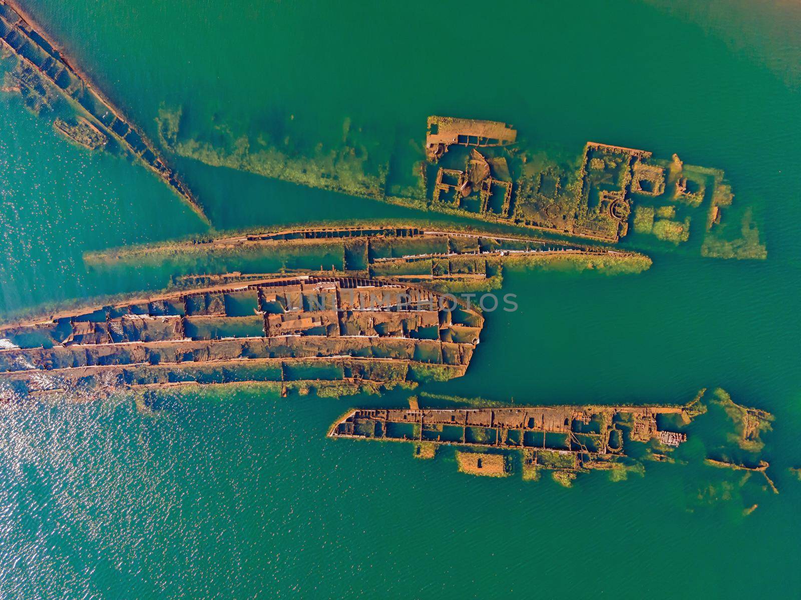 Abandoned broken shipwreck sticking out of the sea by galitskaya