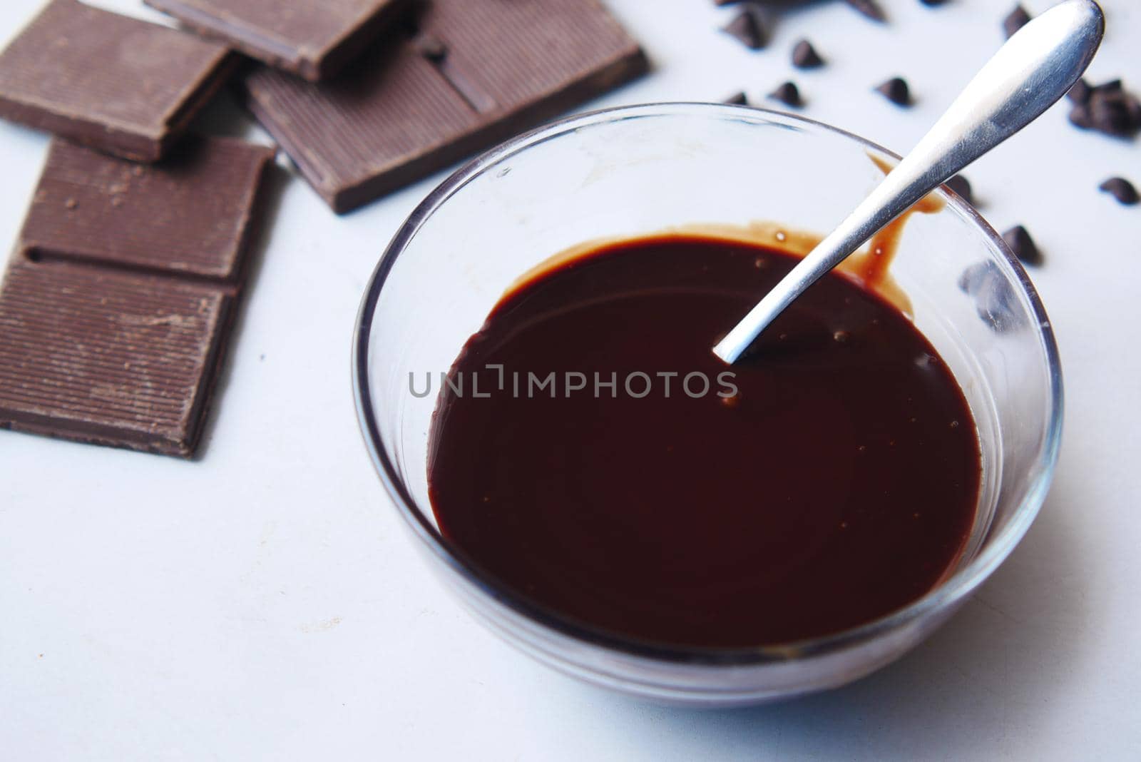 dark chocolate cream in a bowl on white .