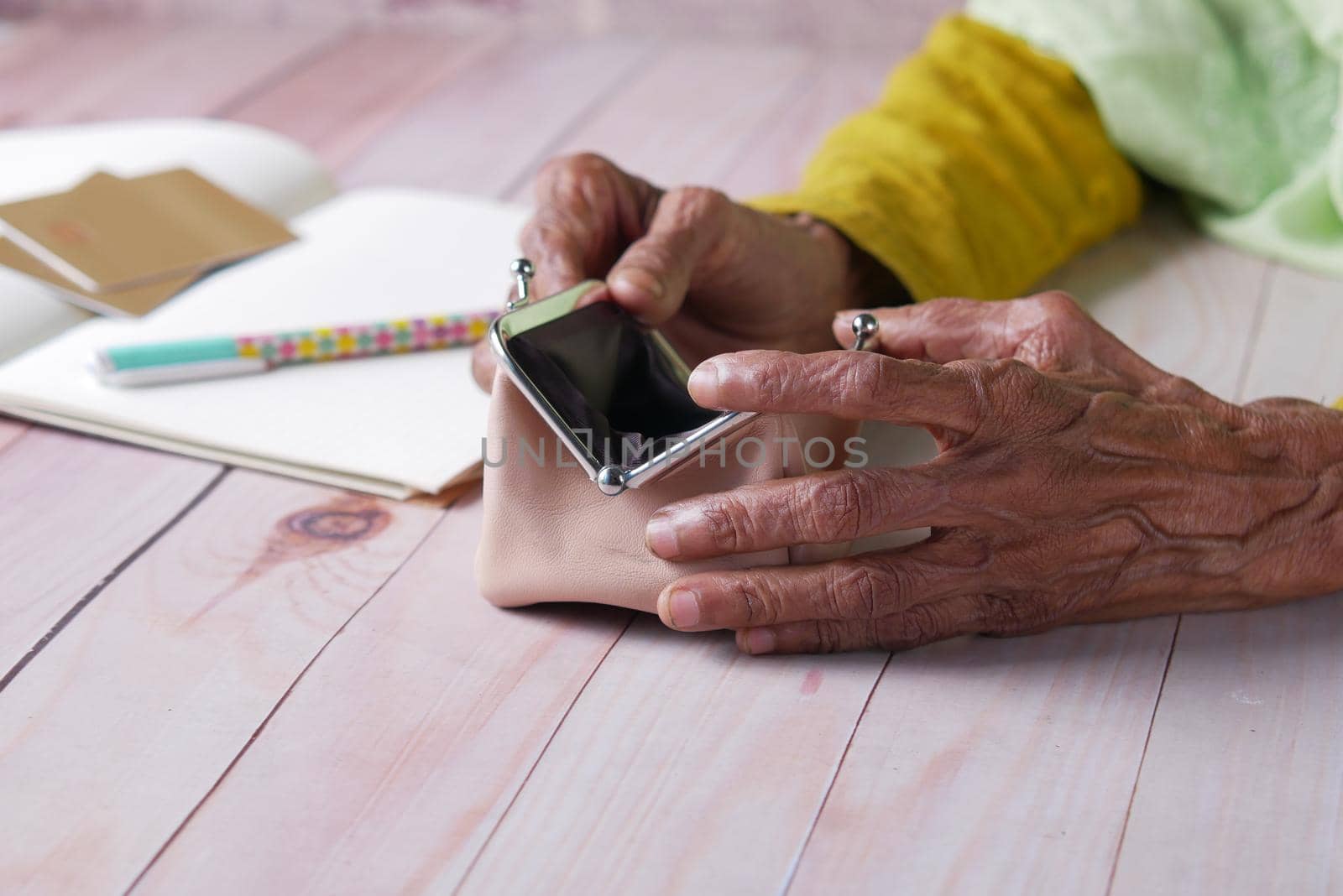 senior women hand open an empty wallet with copy space..