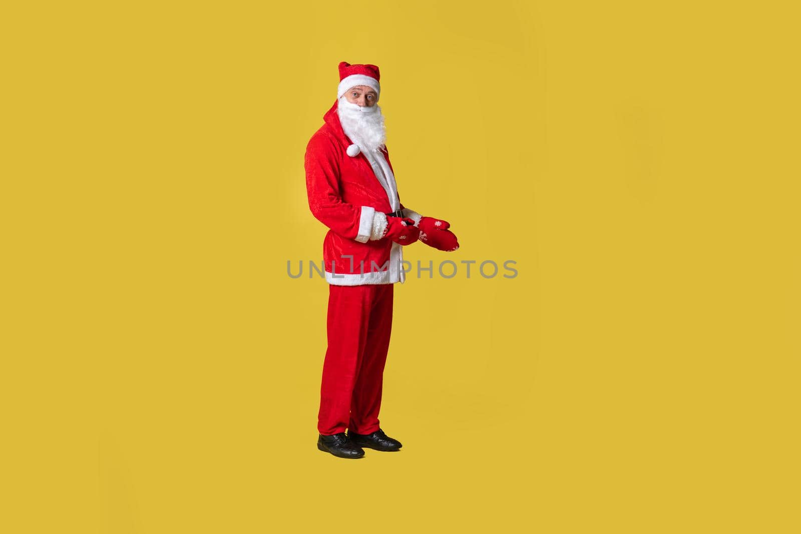 Santa claus yellow funny style, suspenders holiday christmas winter old. Fashionable bearded mature, diet Hands keeps down shows
