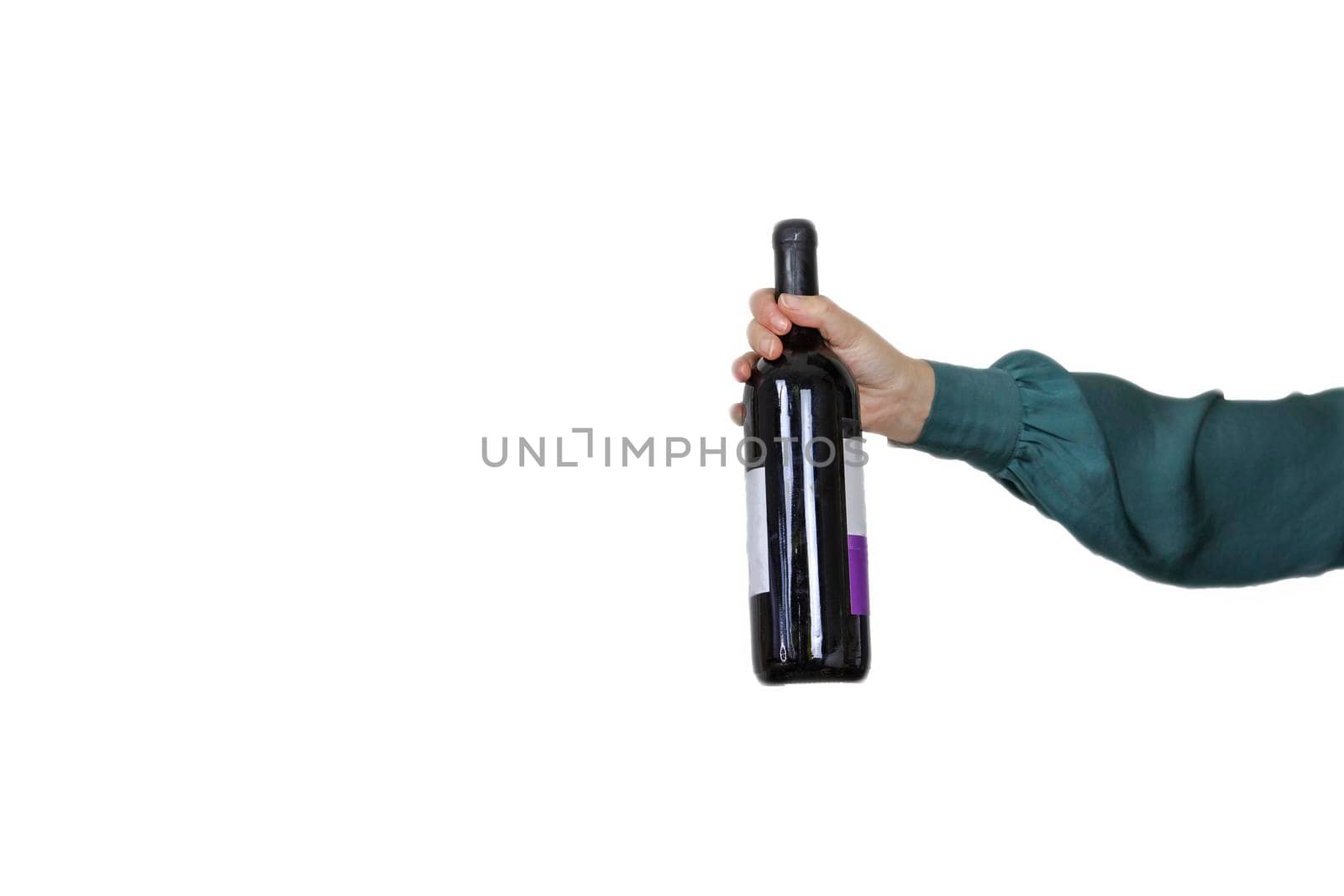 Female holding bottle of expensive red wine isolated on white background, giving gift, party, alcohol concept space for text