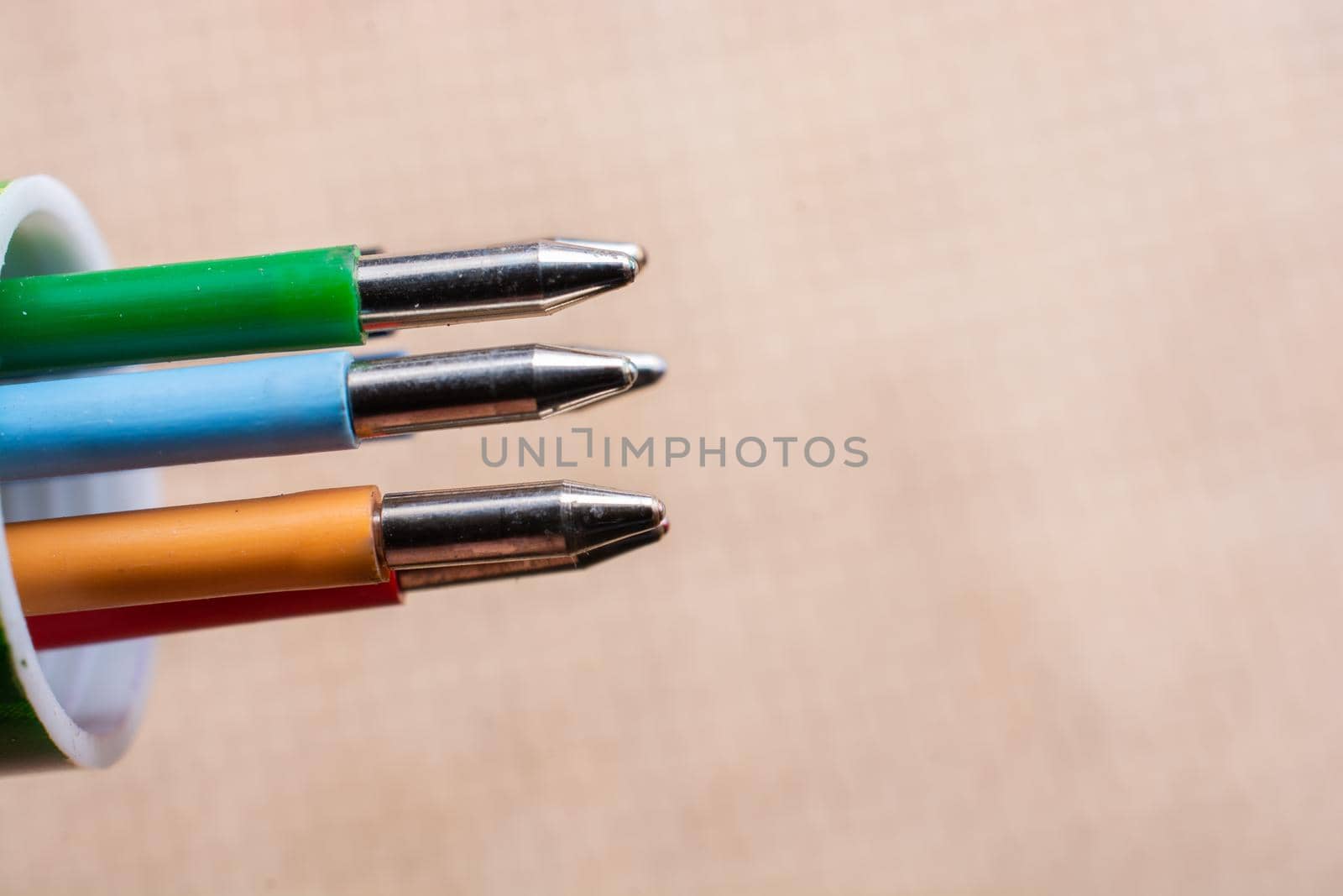 Multi colored pen on a textured background on display