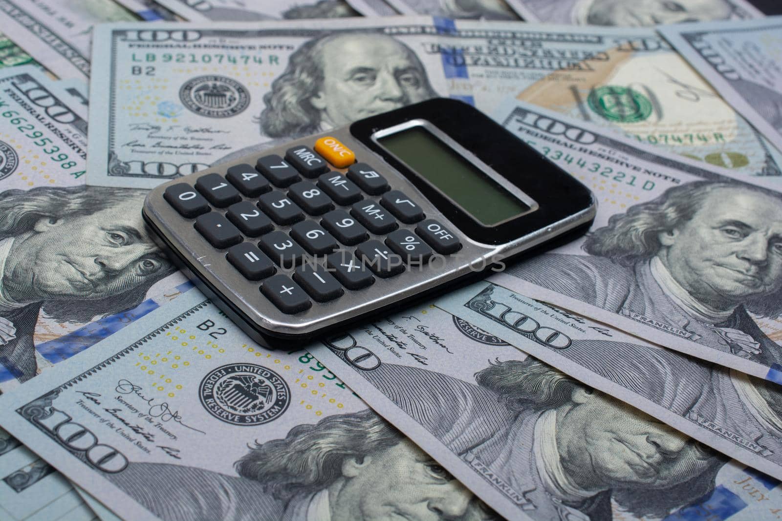 Calculator with Background of US Dollar Banknotes,  by berkay