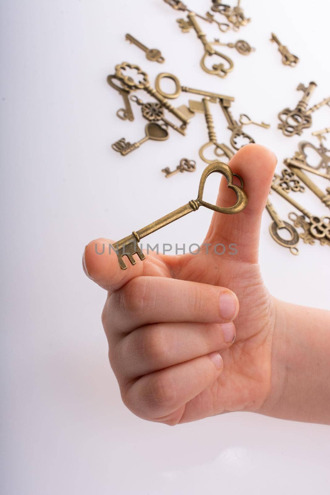 Hand holding retro metal key as love  and Valentine concept