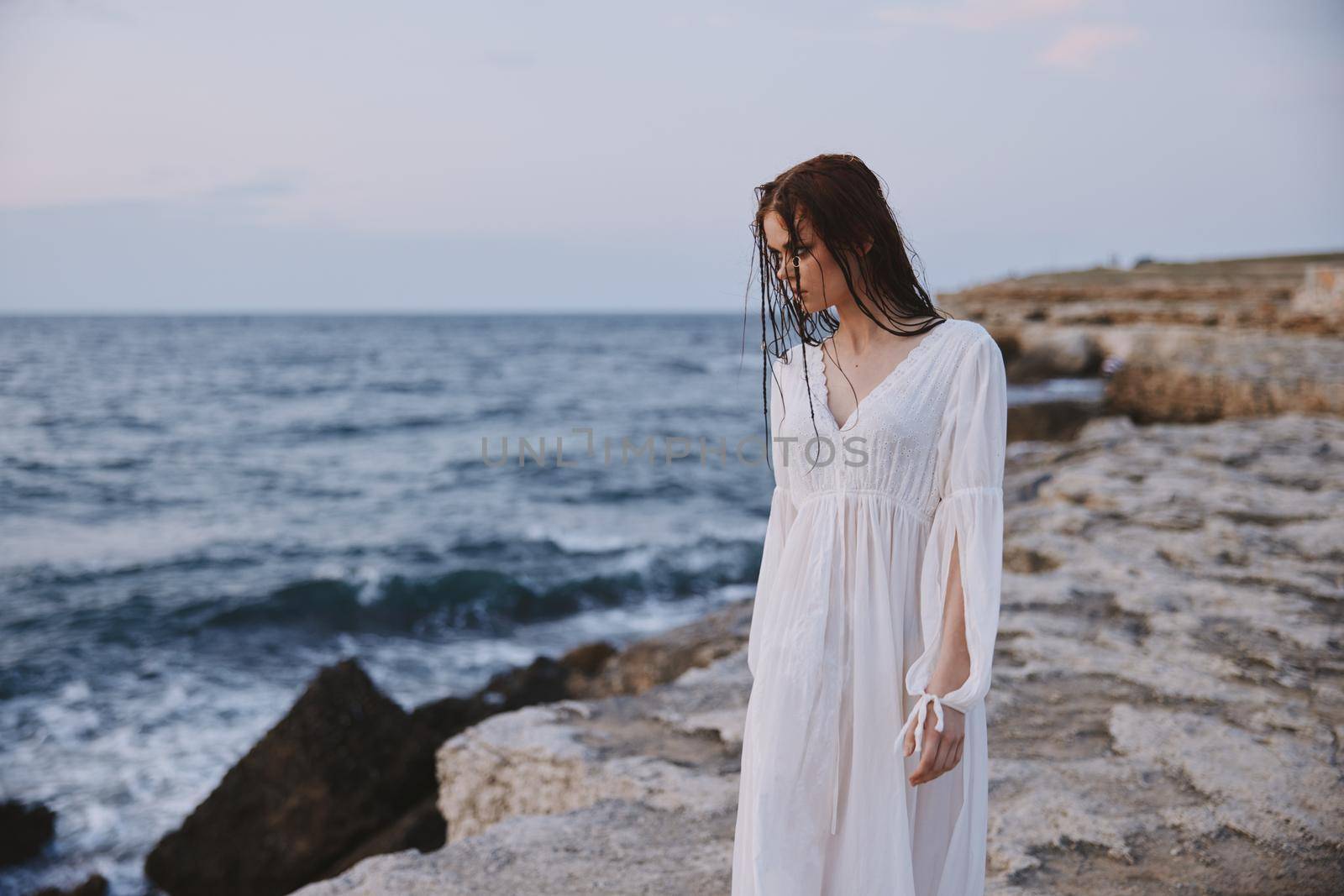 Beautiful woman walks volcanic rock formations on the island Lifestyle. High quality photo