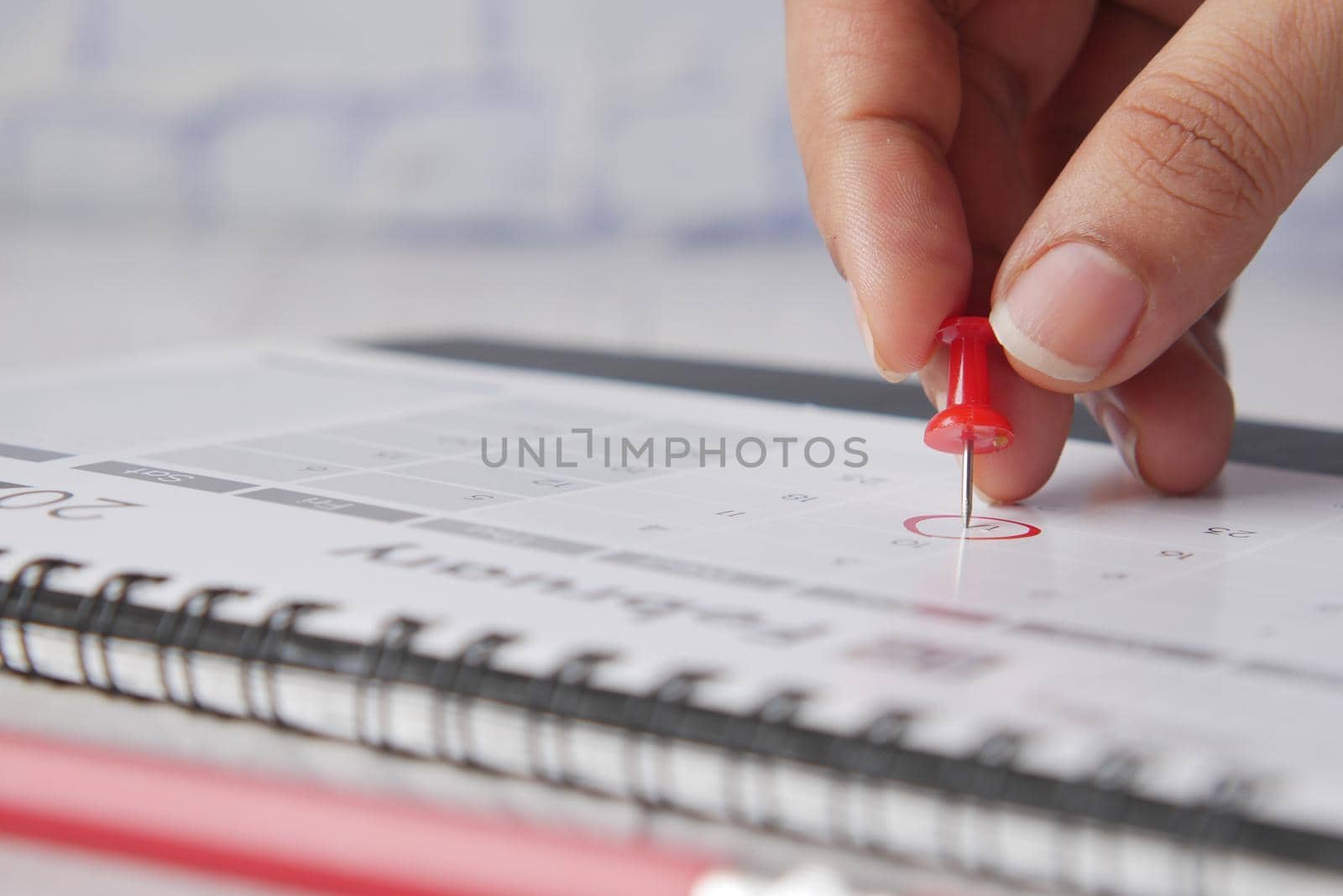 deadline concept with push pin on calendar date close up .