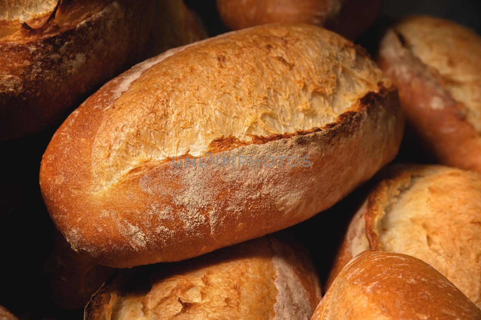 Fresh hot appetizing bread after baking in the oven. Close-up healthy and tasty food.